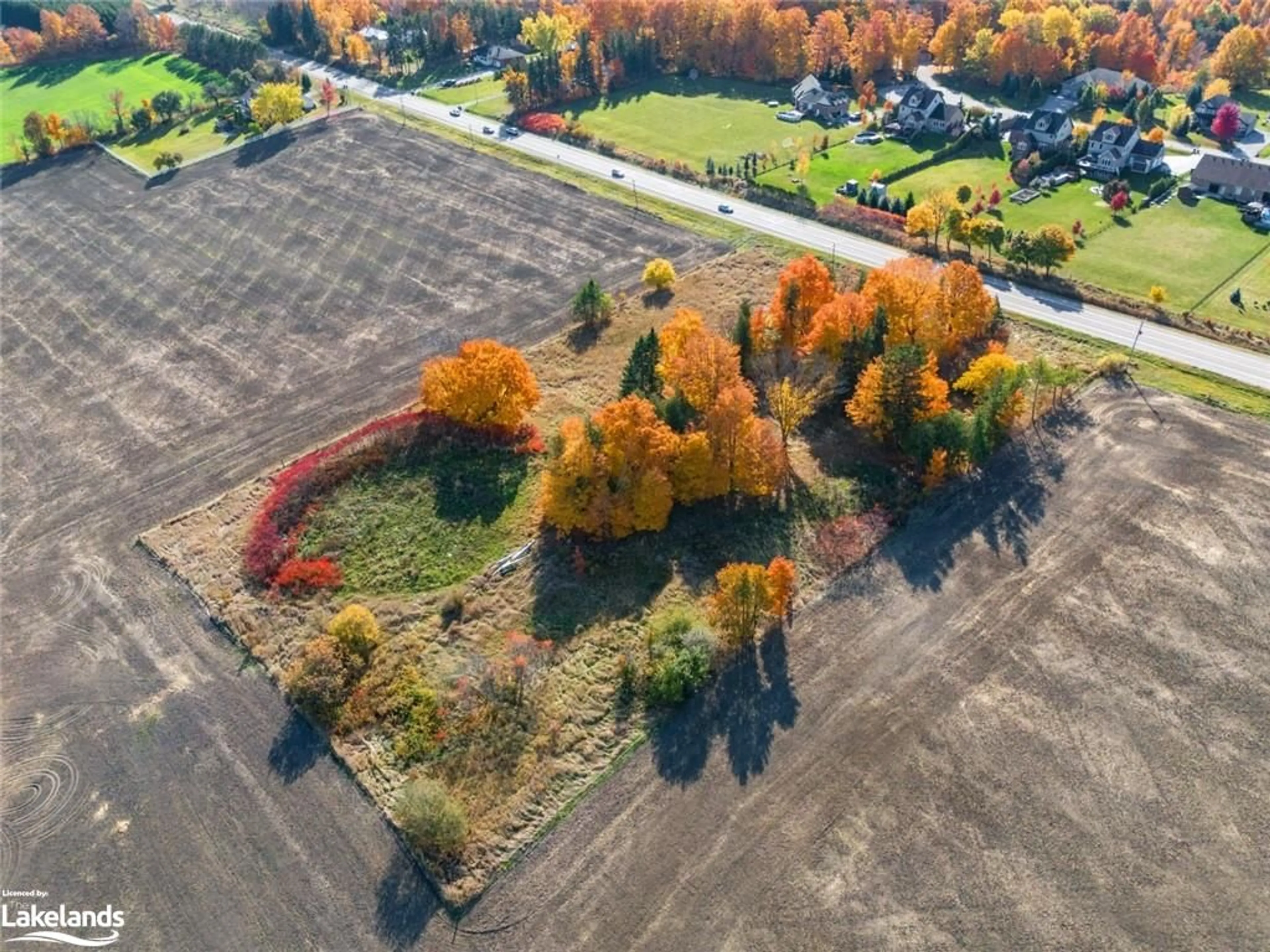 A pic from exterior of the house or condo, the fenced backyard for 2500 Highway 26, Minesing Ontario L9X 0Z8