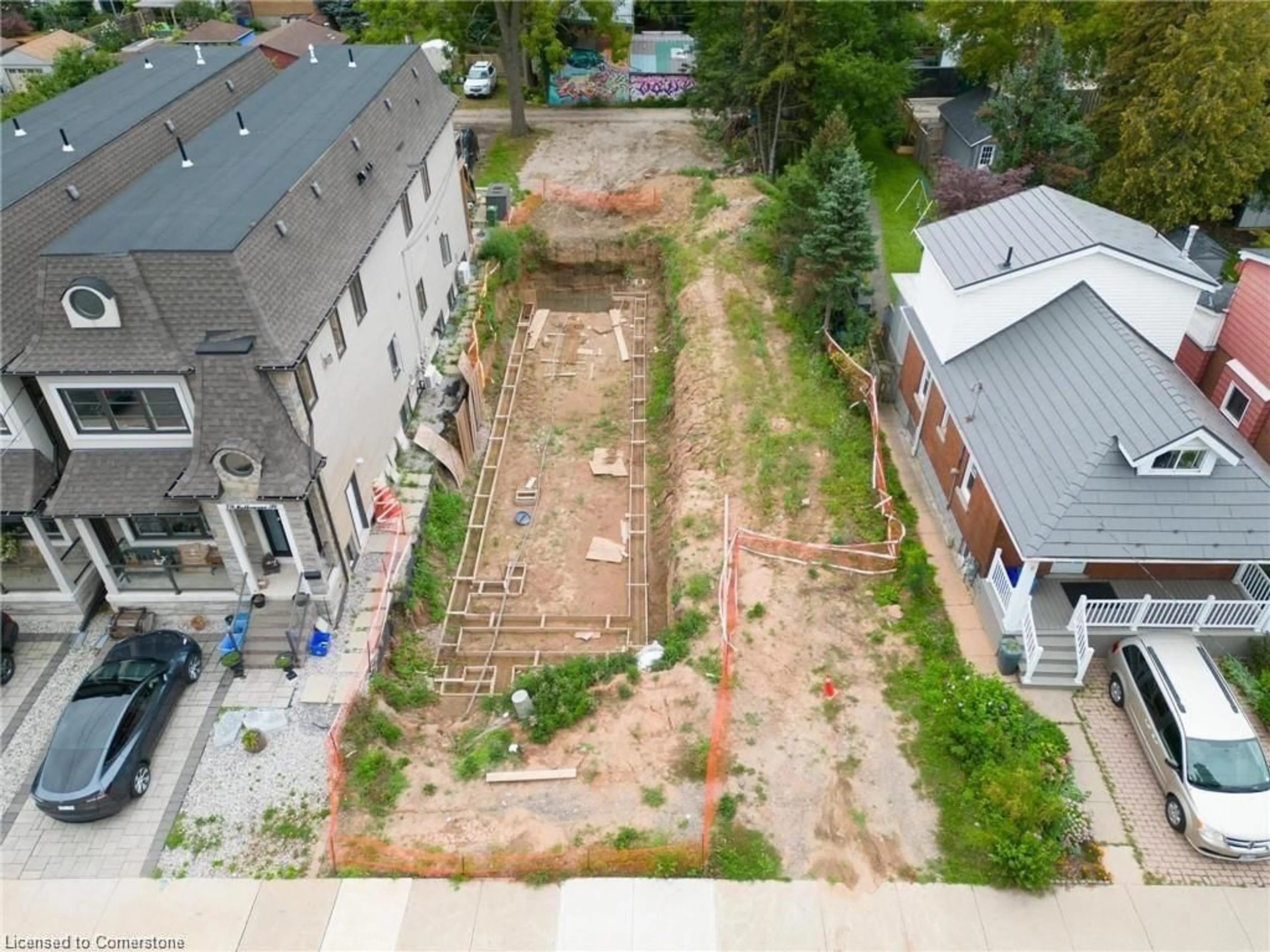 Frontside or backside of a home, the fenced backyard for 85 Melbourne St, Hamilton Ontario L8P 2A5