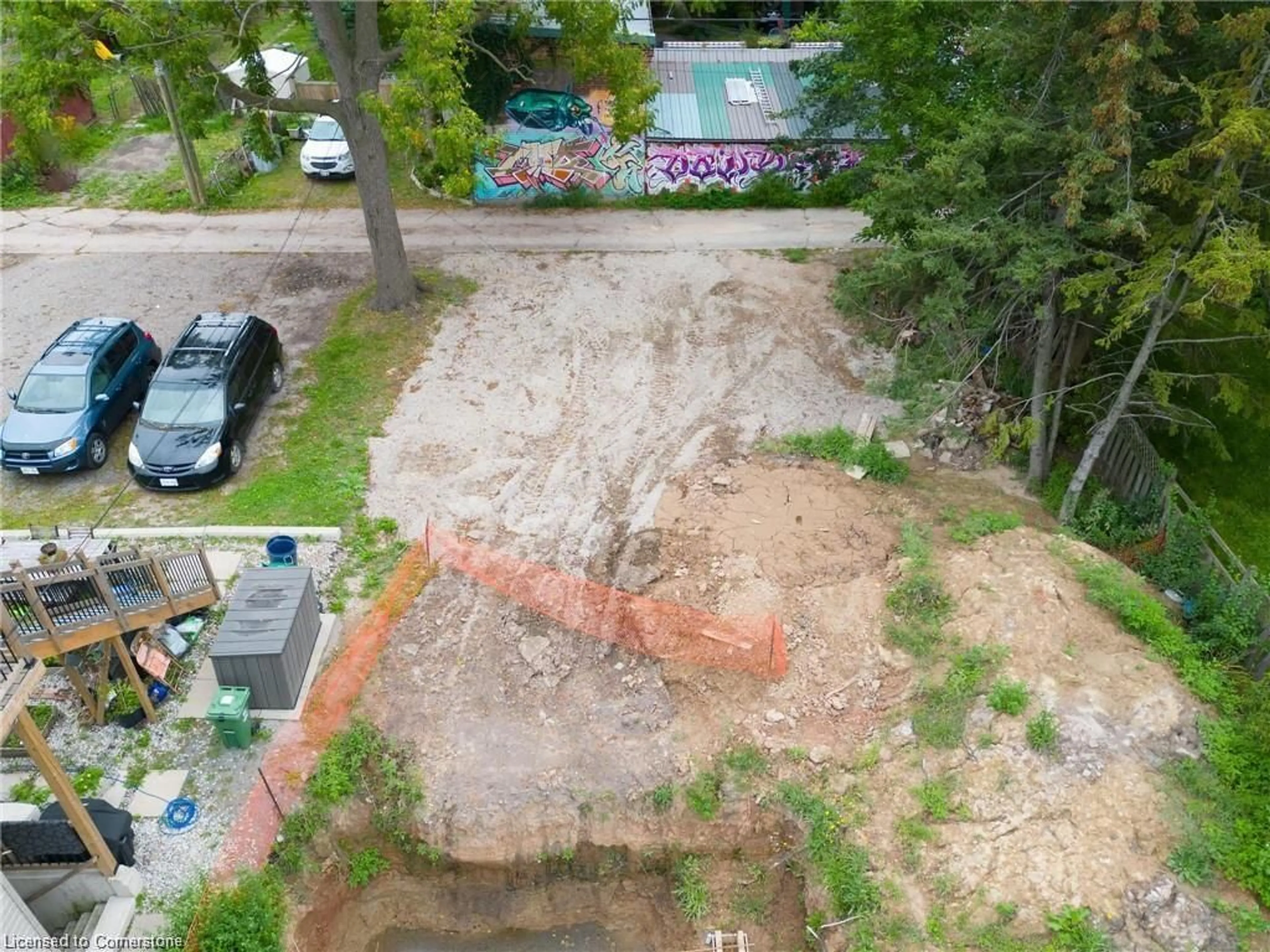 Frontside or backside of a home, the fenced backyard for 85 Melbourne St, Hamilton Ontario L8P 2A5