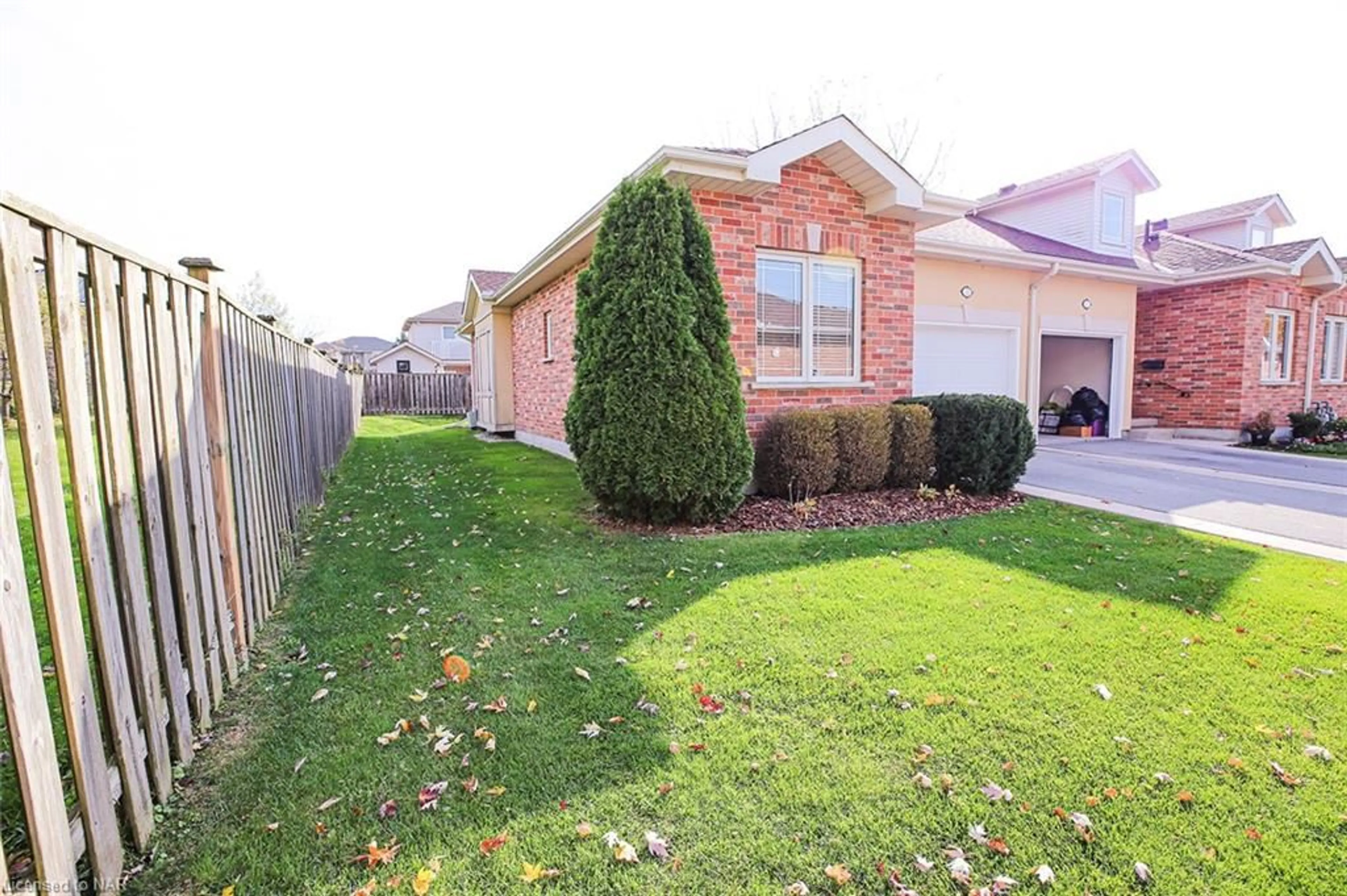 A pic from exterior of the house or condo, the fenced backyard for 4300 Kalar Rd #11, Niagara Falls Ontario L2H 1S7