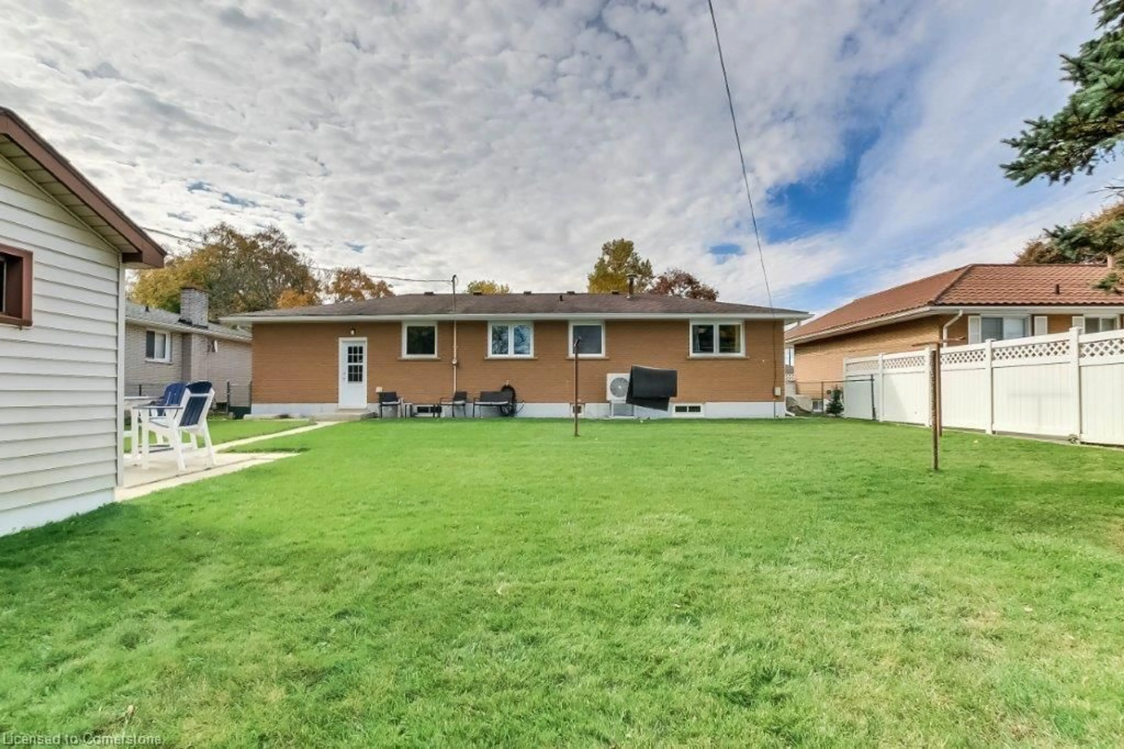 Frontside or backside of a home, the fenced backyard for 349 Spydell St, Delhi Ontario N4B 2T8