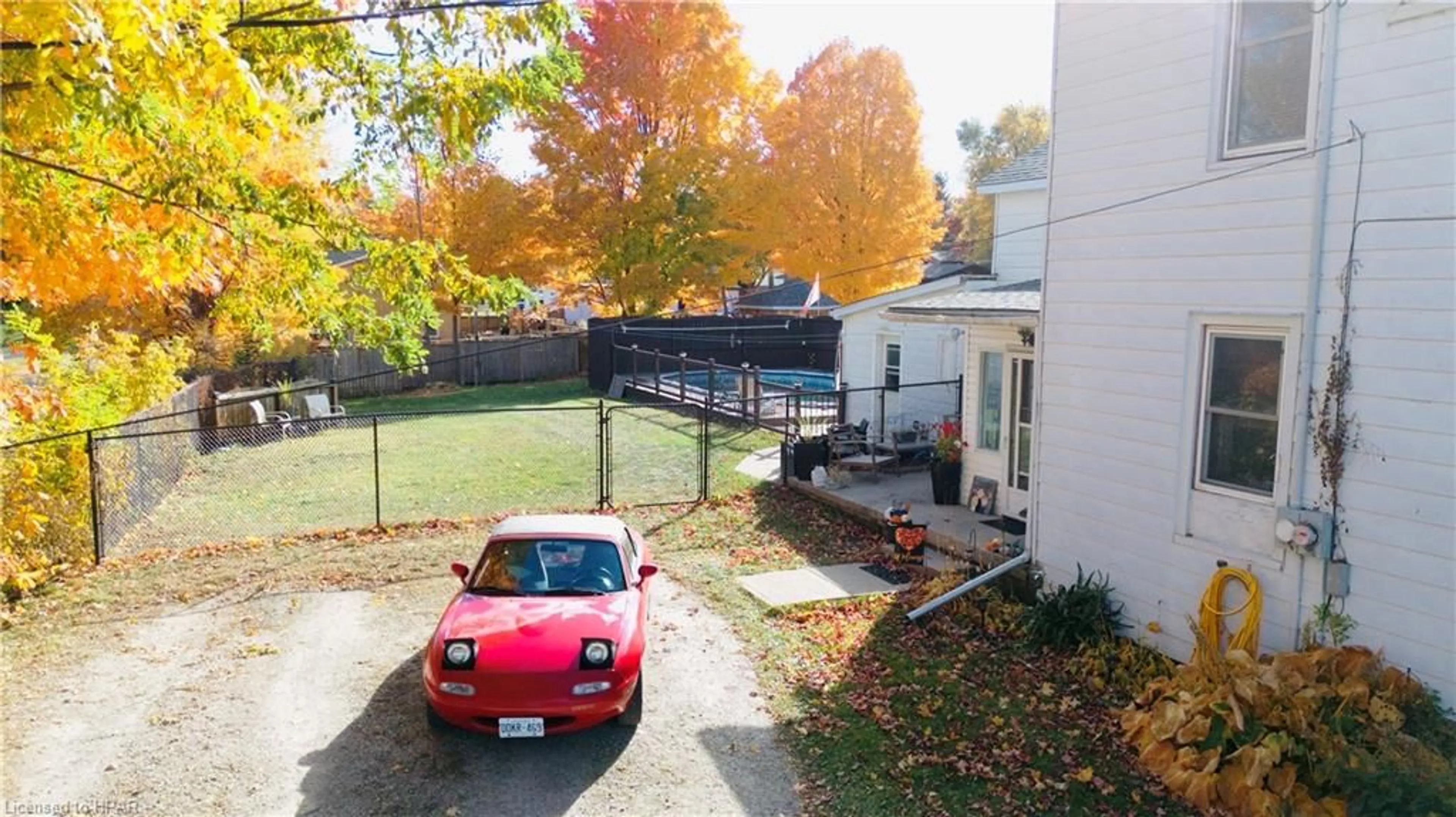 A pic from exterior of the house or condo, the fenced backyard for 201 Joseph St, Walkerton Ontario N0G 2V0