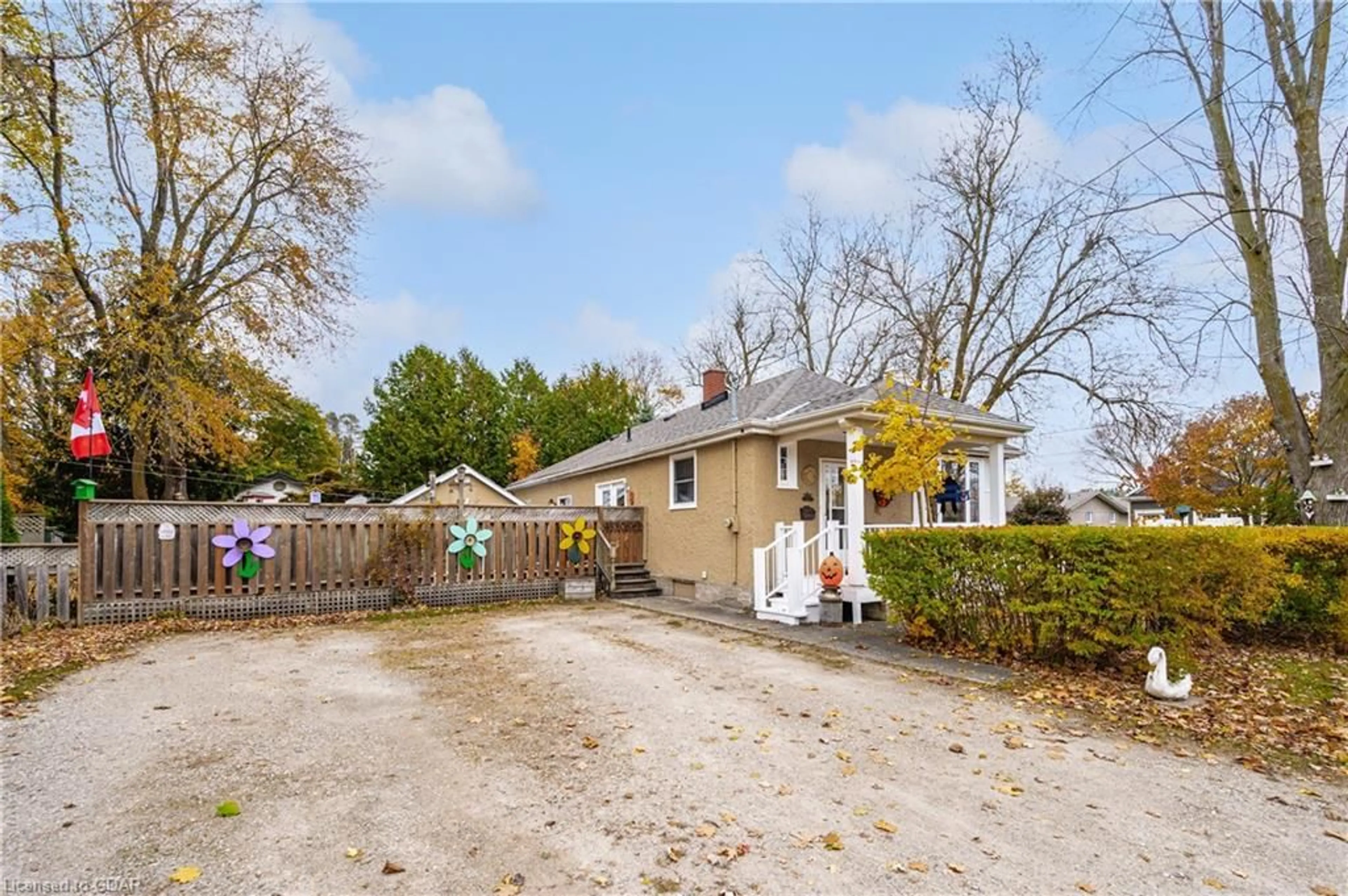 A pic from exterior of the house or condo, the fenced backyard for 55 John St, Elora Ontario N0B 1S0