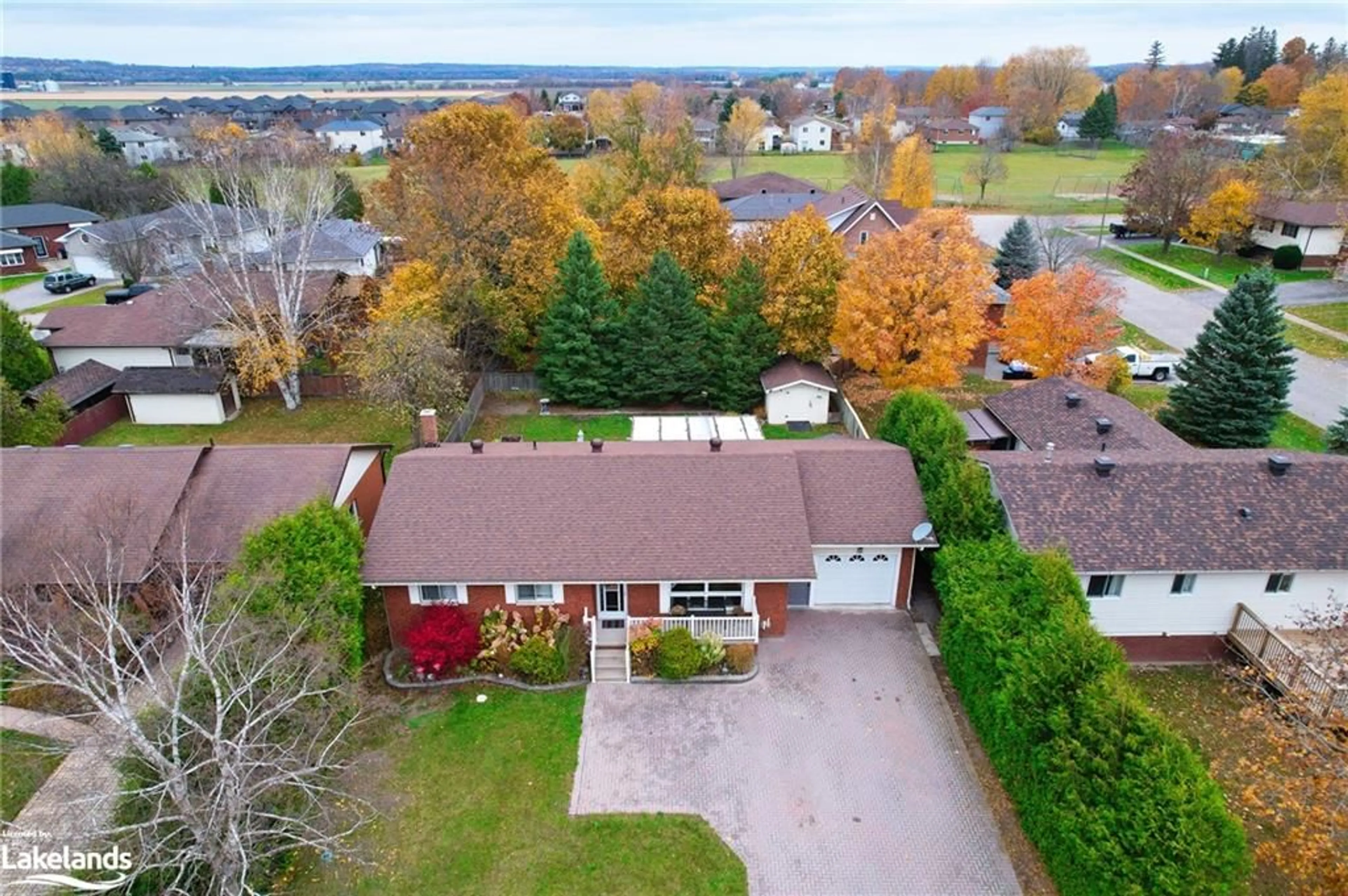 Frontside or backside of a home, the fenced backyard for 29 Shaw St, Elmvale Ontario L0L 1P0