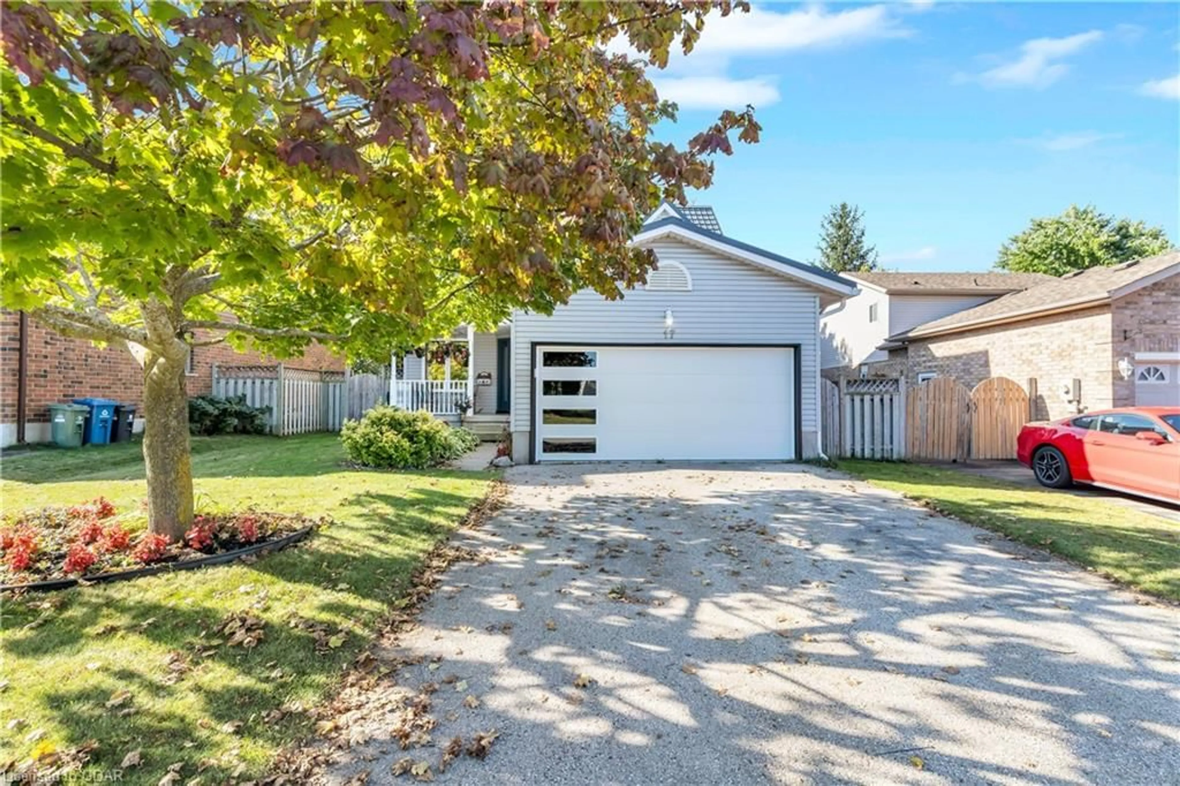 Frontside or backside of a home, the fenced backyard for 17 Abbeywood Cres, Guelph Ontario N1K 1T9