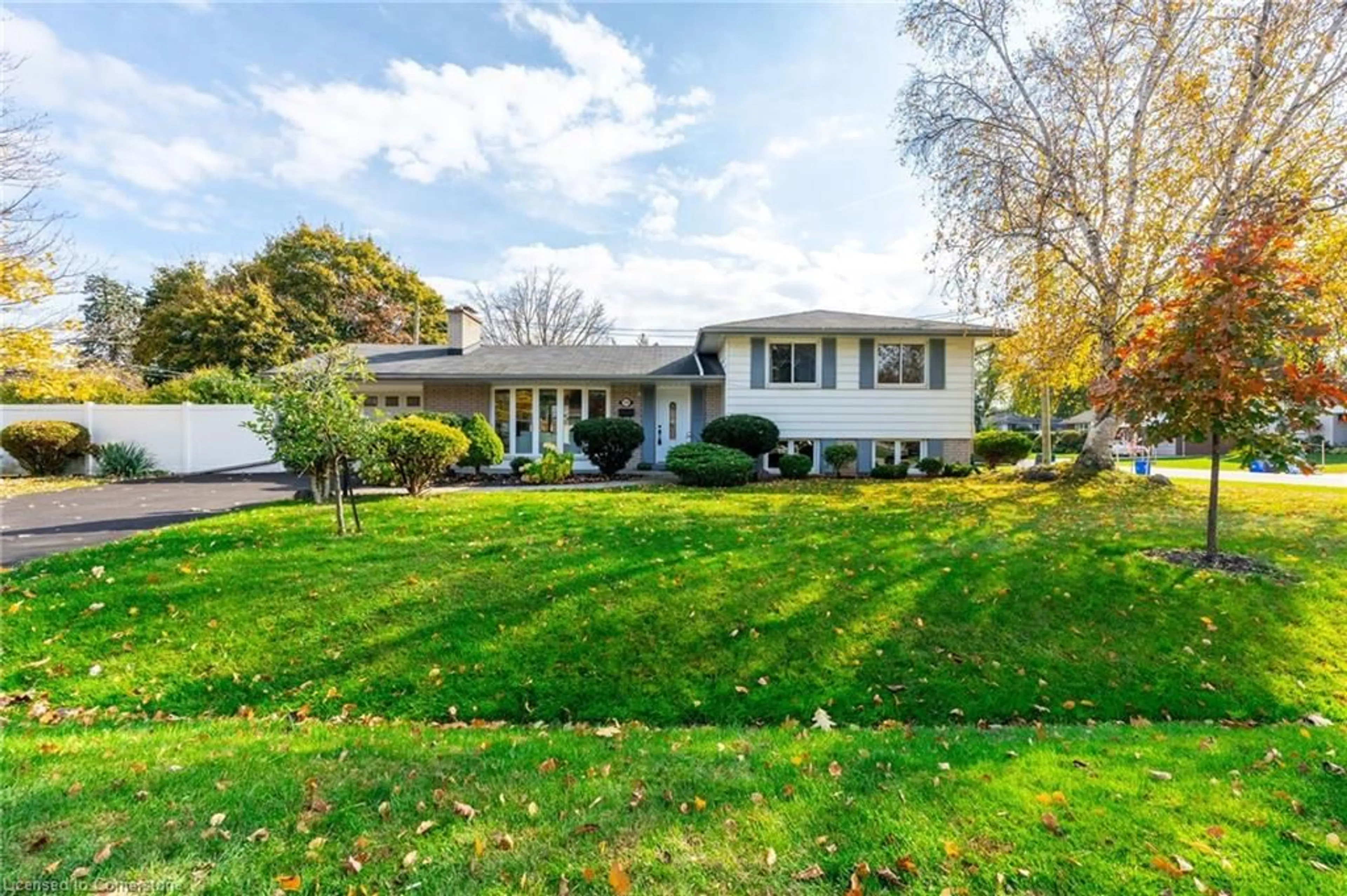 Frontside or backside of a home, the fenced backyard for 228 Plumtree Dr, Burlington Ontario L7T 2G9