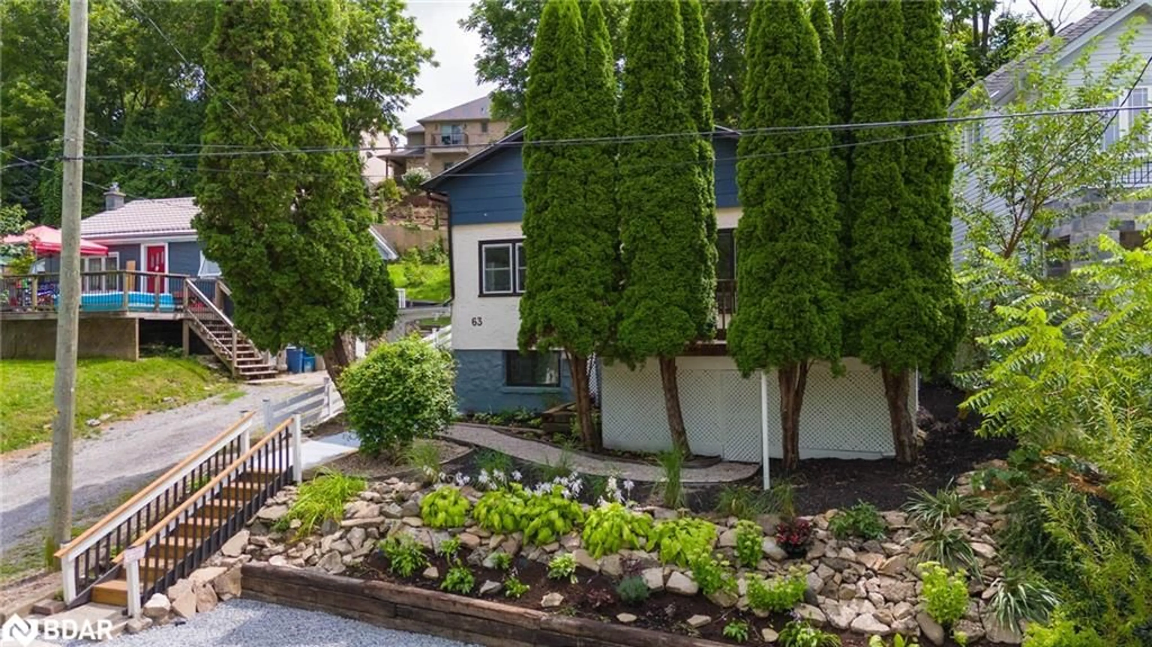 A pic from exterior of the house or condo, the fenced backyard for 63 Bradley St, St. Catharines Ontario L2T 1R5