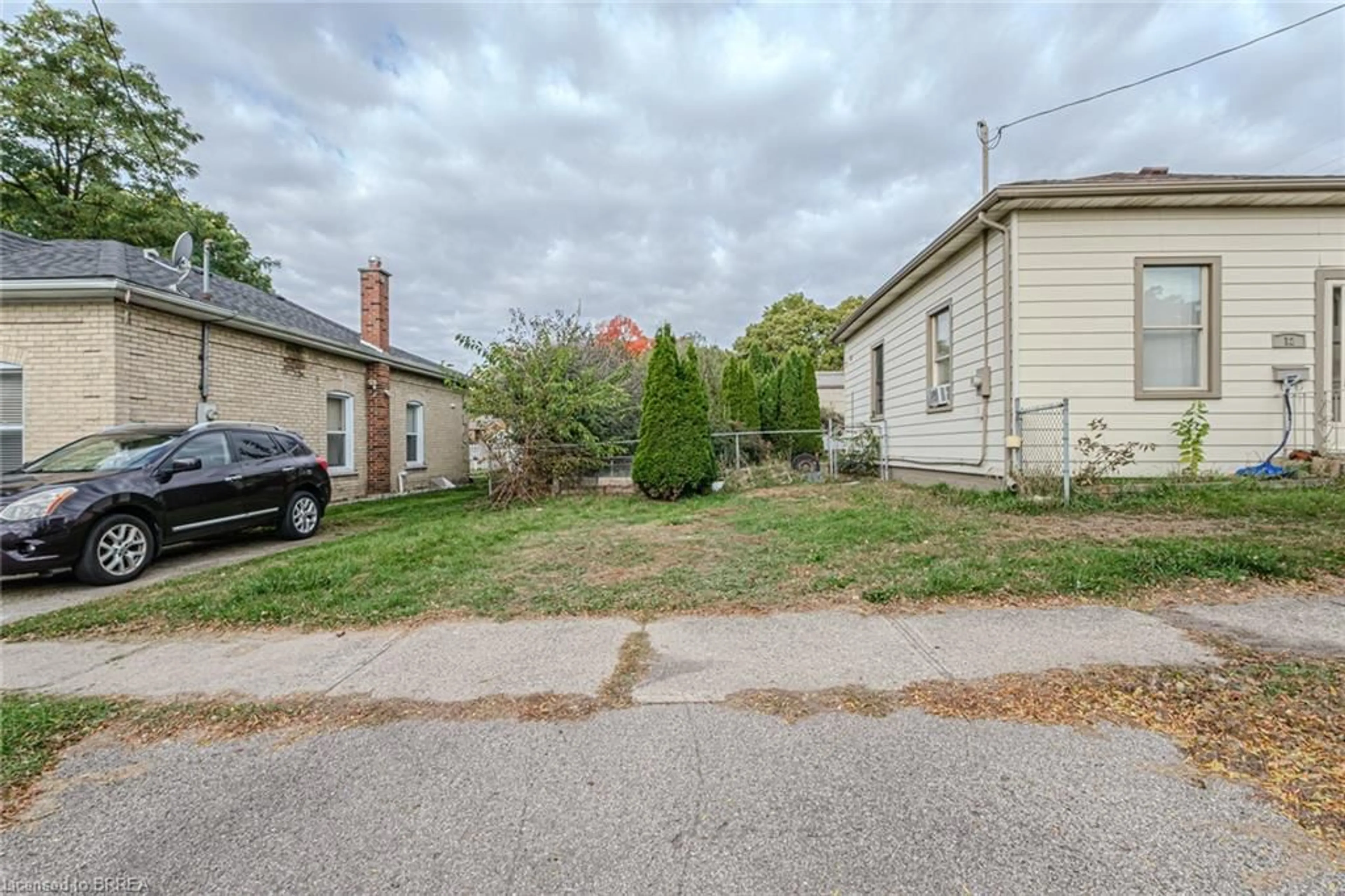 Frontside or backside of a home, the street view for 12 Ann St, Brantford Ontario N3R 3X8