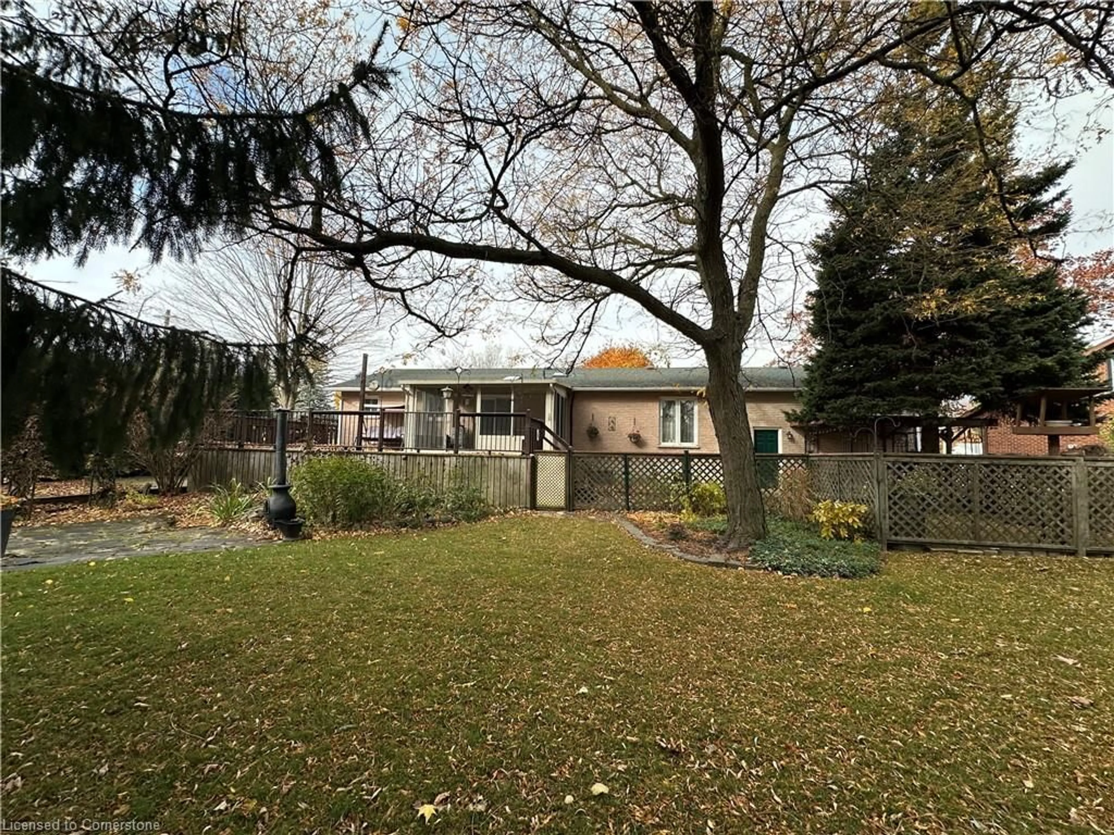 Frontside or backside of a home, the fenced backyard for 486 Toronto St St, Palmerston Ontario N0G 2P0