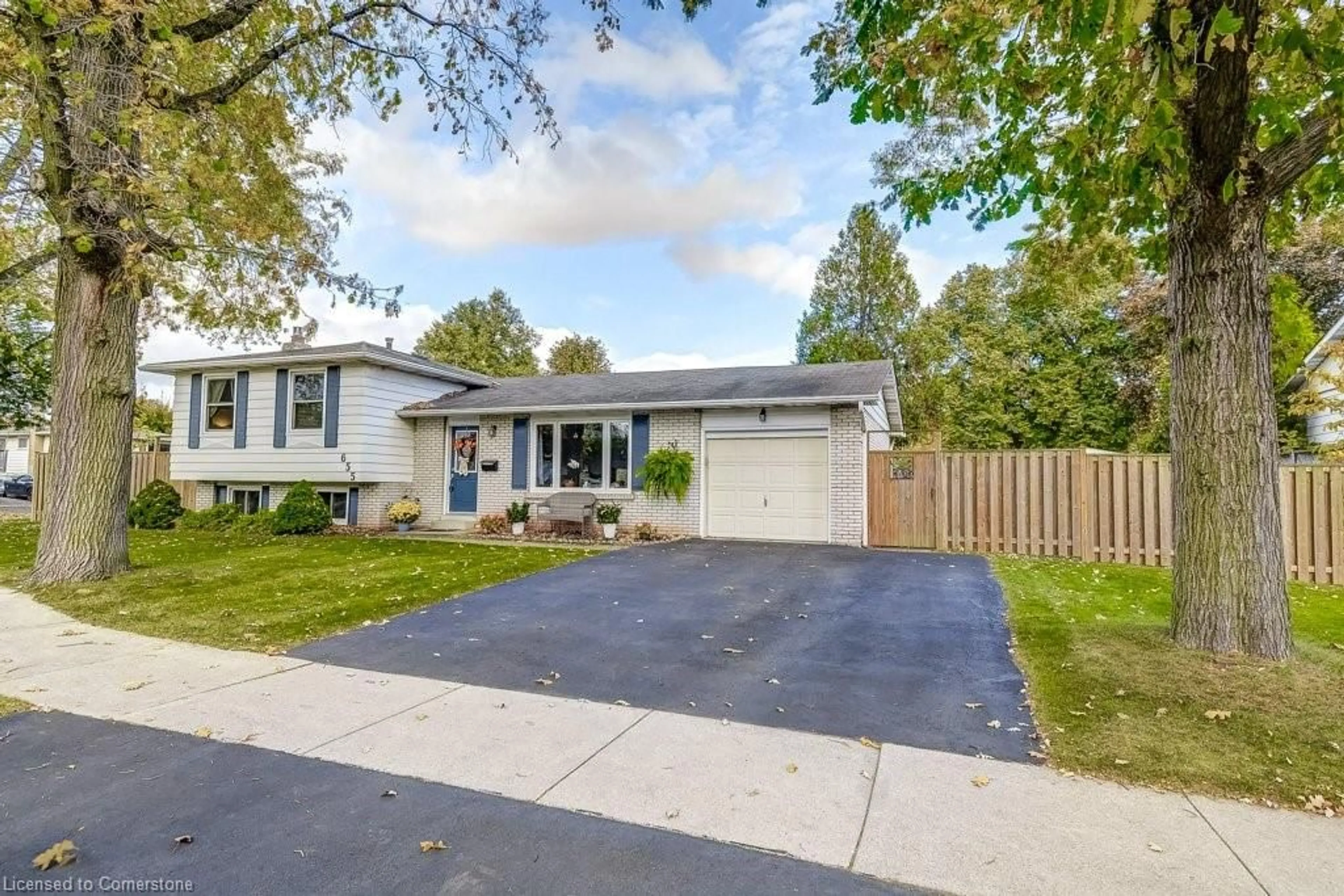 Frontside or backside of a home, the fenced backyard for 655 Cumberland Ave, Burlington Ontario L7N 2X4