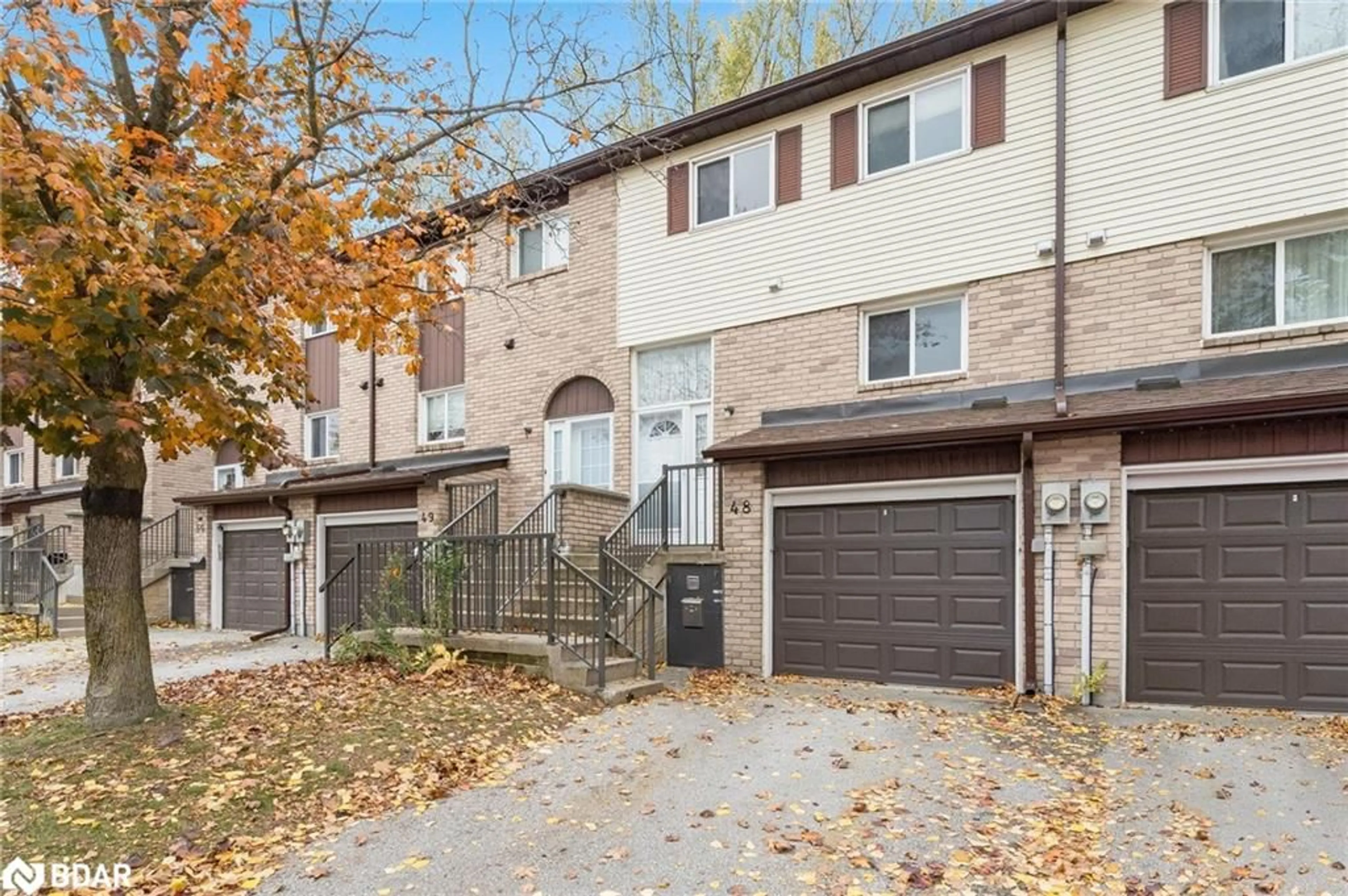 A pic from exterior of the house or condo, the fenced backyard for 72 Adelaide St #48, Barrie Ontario L4N 3T5