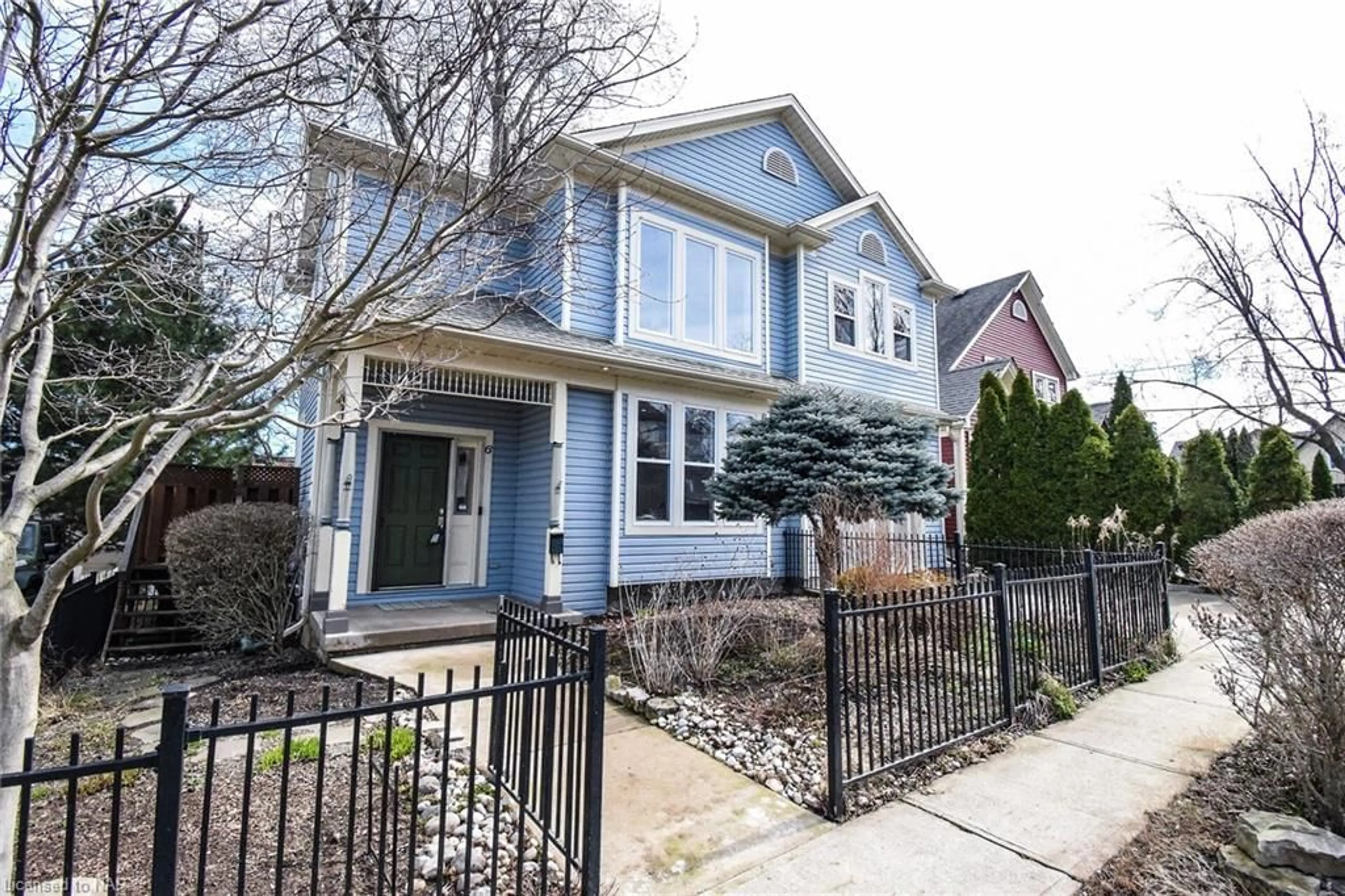 Frontside or backside of a home, the fenced backyard for 6 Gertrude St, St. Catharines Ontario L2N 5C1