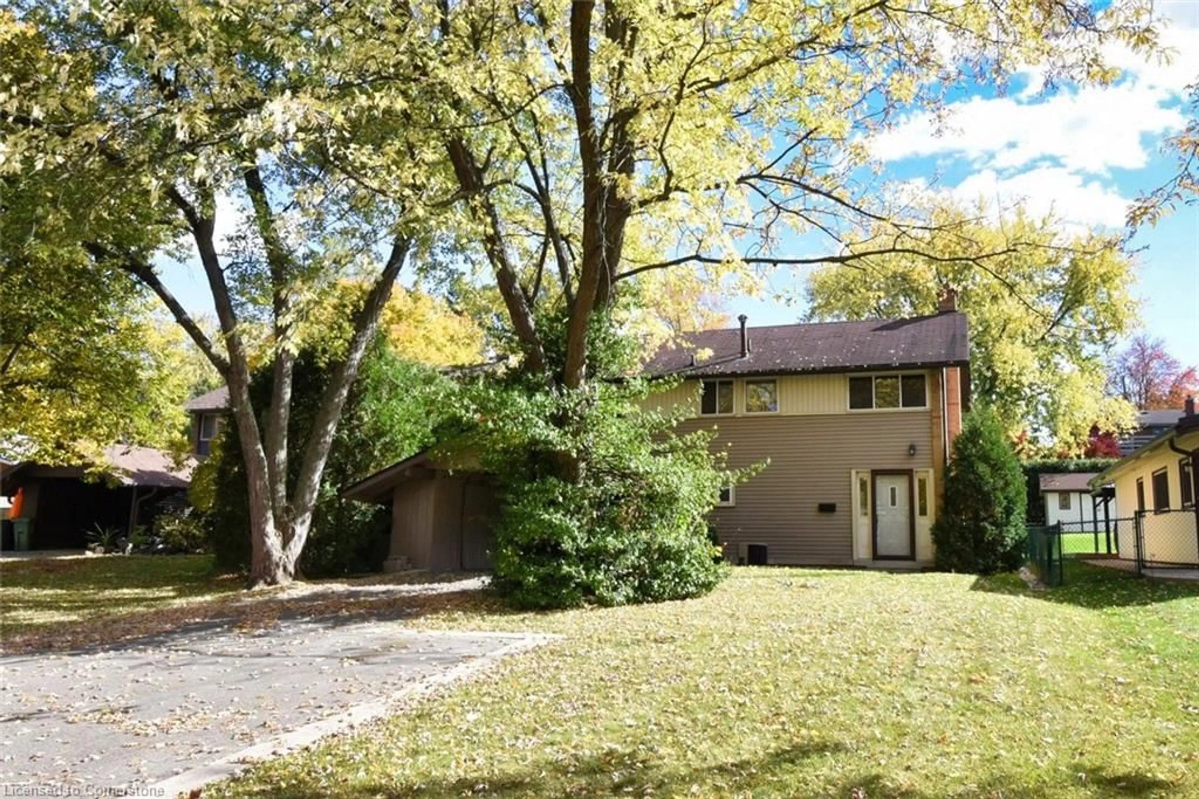 A pic from exterior of the house or condo, the fenced backyard for 18 Pleasant Ave, Dundas Ontario L9H 3S7