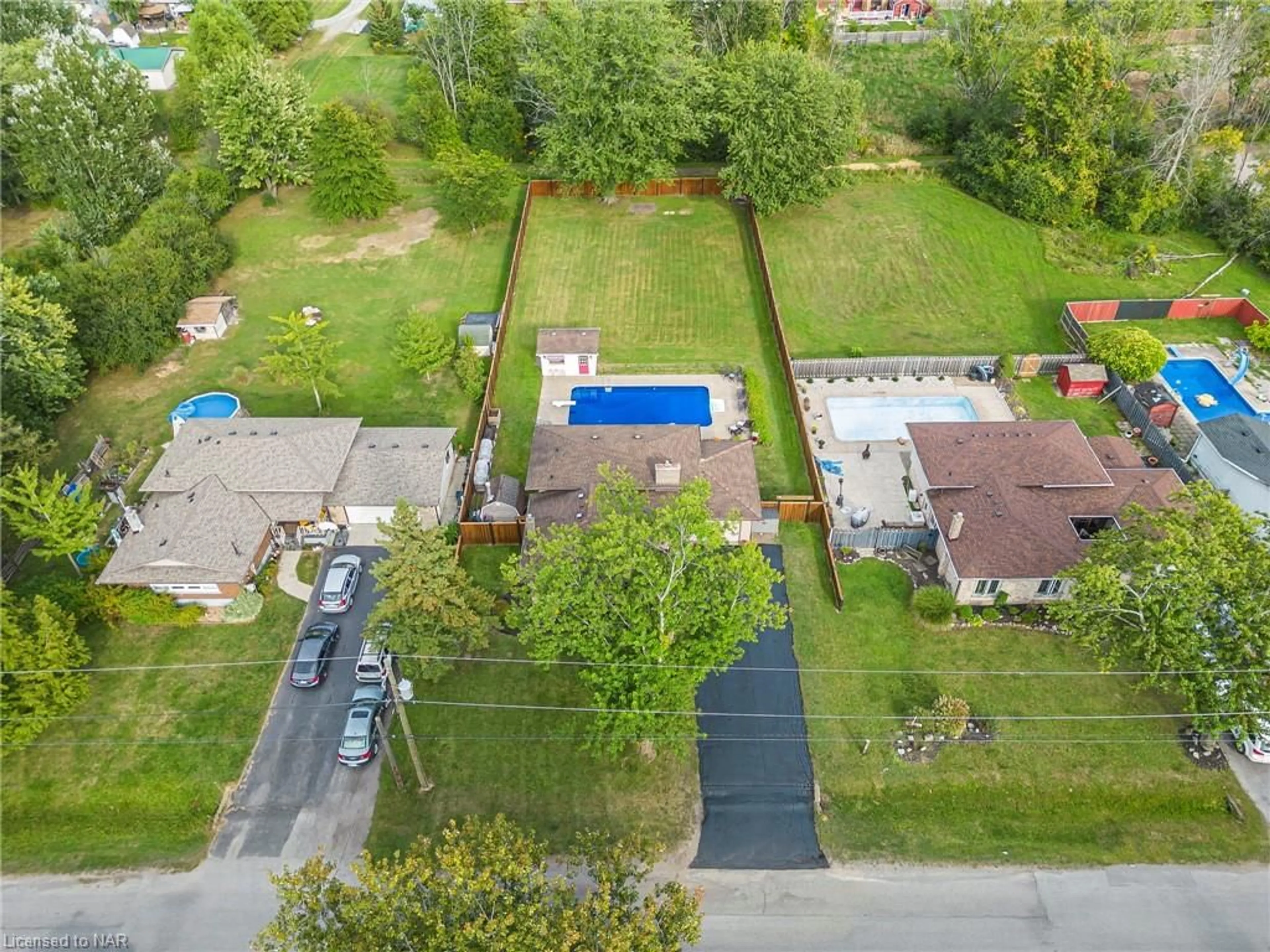 Frontside or backside of a home, the fenced backyard for 796 Grandview Rd, Fort Erie Ontario L2A 4V7