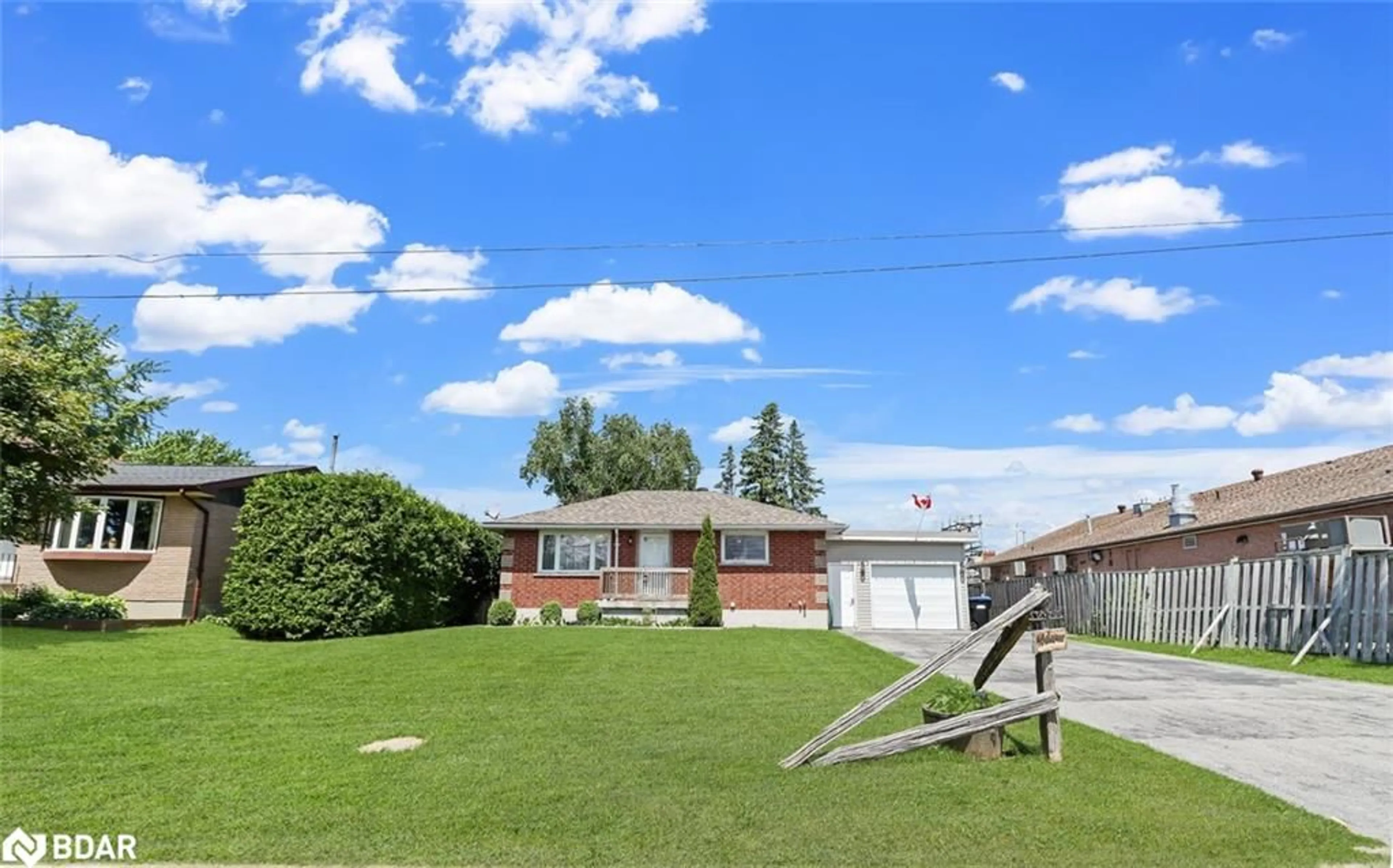 Frontside or backside of a home, the fenced backyard for 8 Robinson Rd, Elmvale Ontario L0L 1P0