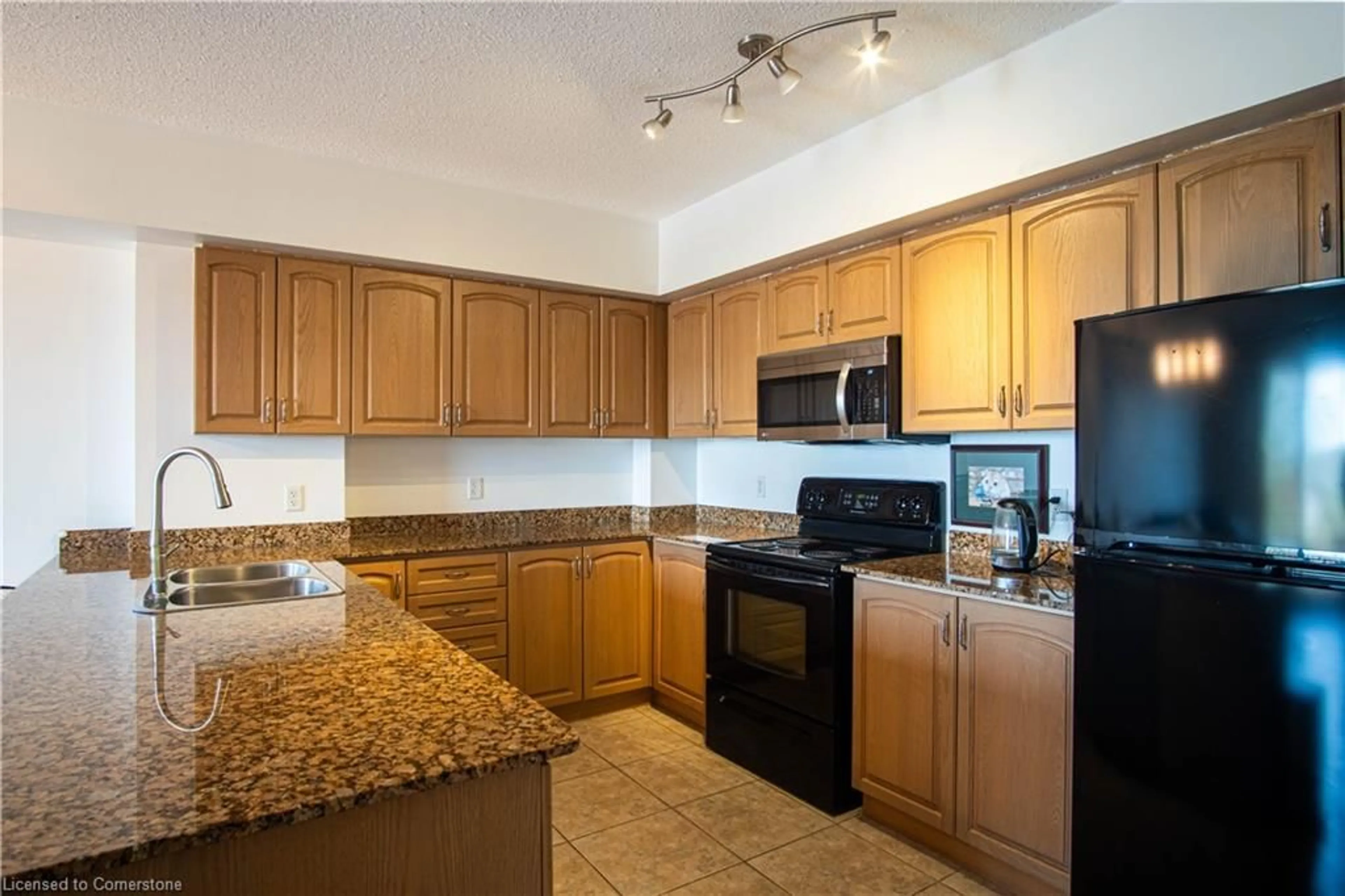 Standard kitchen, wood floors for 47 Caroline St #502, Hamilton Ontario L8R 2R6