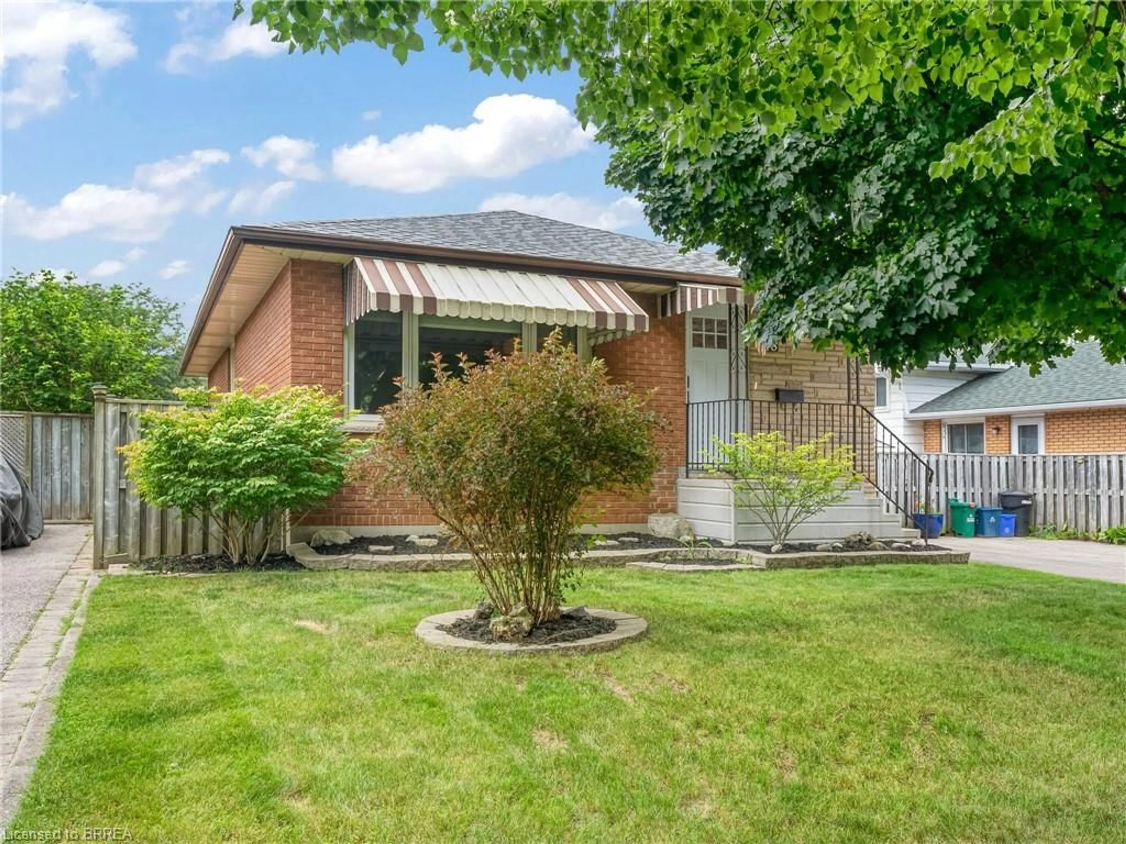 Frontside or backside of a home, the fenced backyard for 48 Palm Cres, Brantford Ontario N3R 5G2