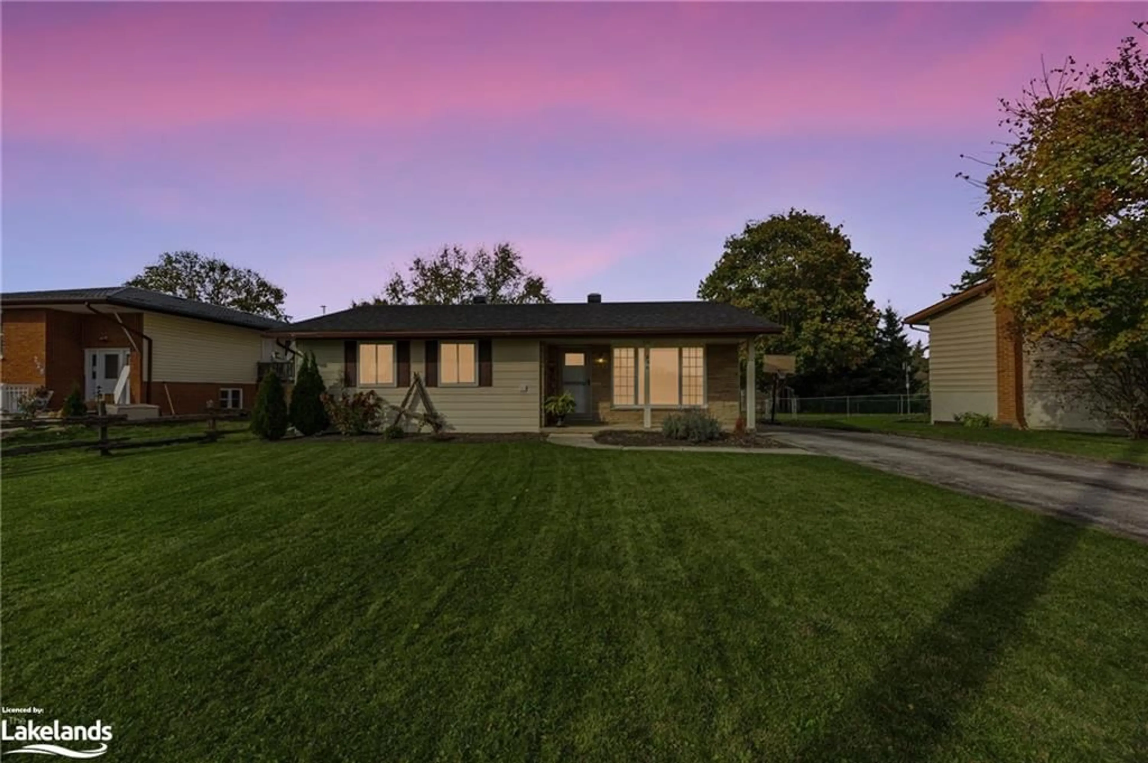 Frontside or backside of a home, the fenced backyard for 230 Christopher St, Clearview Ontario L0M 1S0