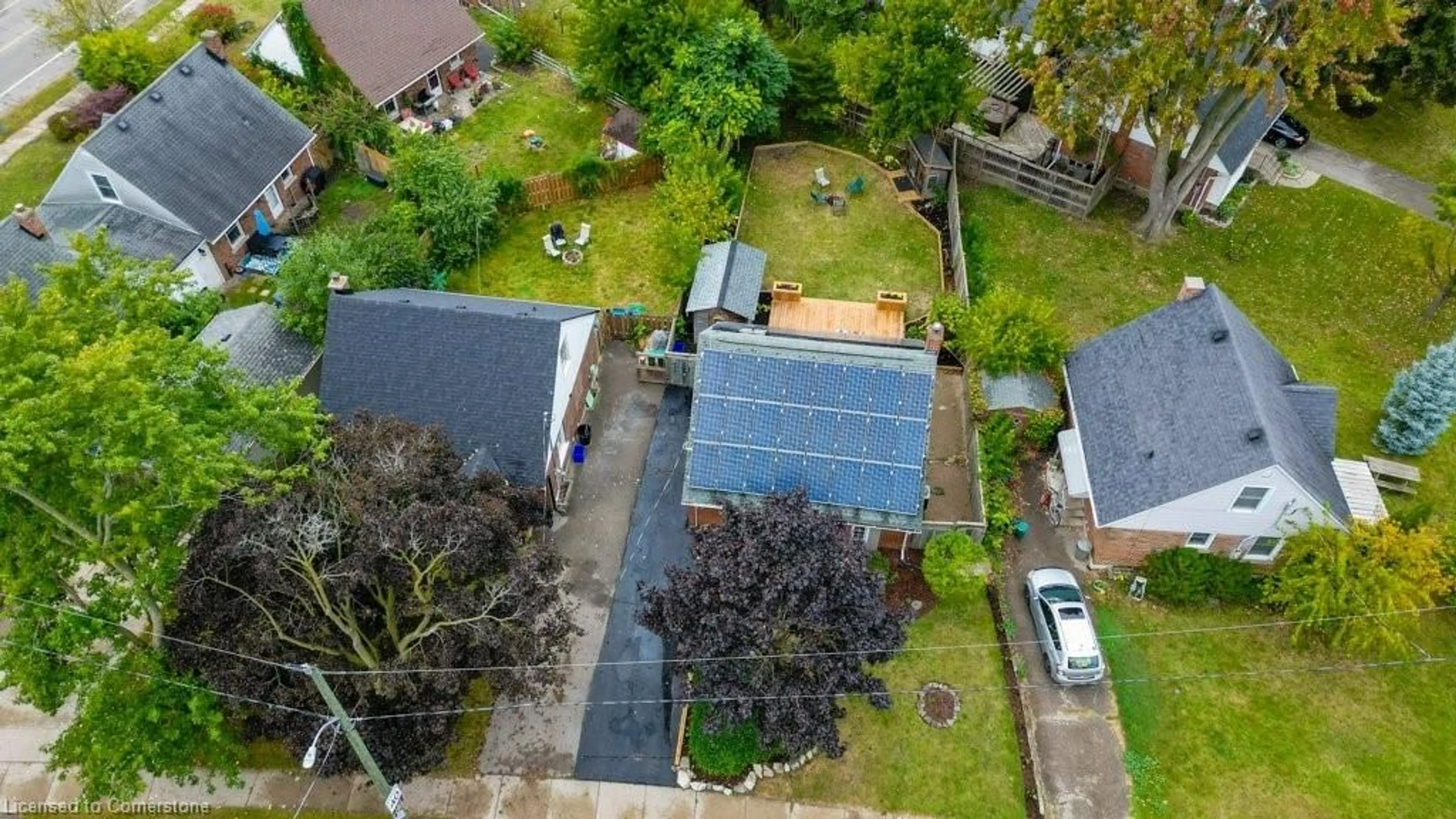 Frontside or backside of a home, the fenced backyard for 142 Spadina Rd, Kitchener Ontario N2M 1G4