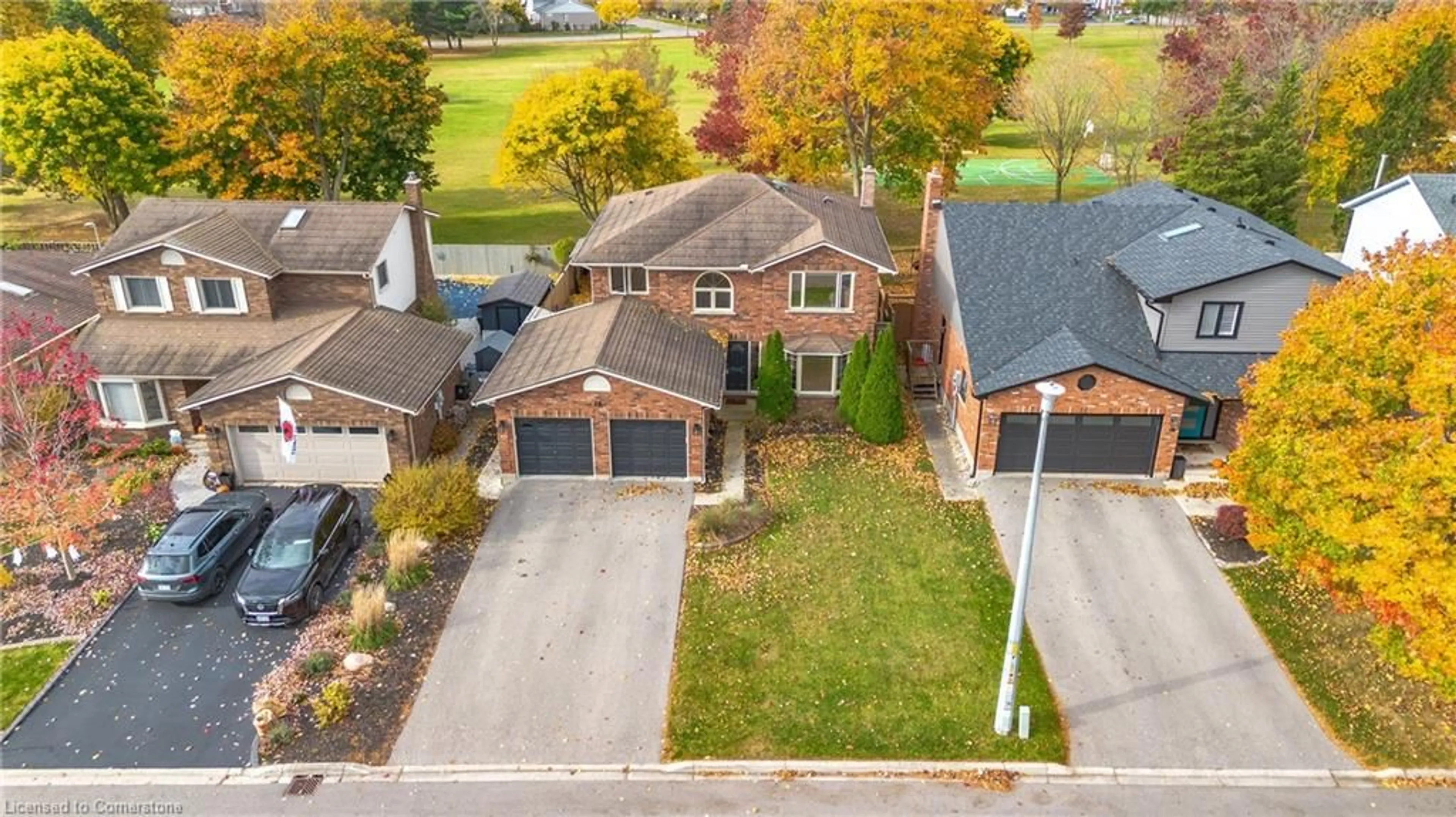 Frontside or backside of a home, the fenced backyard for 18 Rutherford Dr, Simcoe Ontario N3Y 5J7