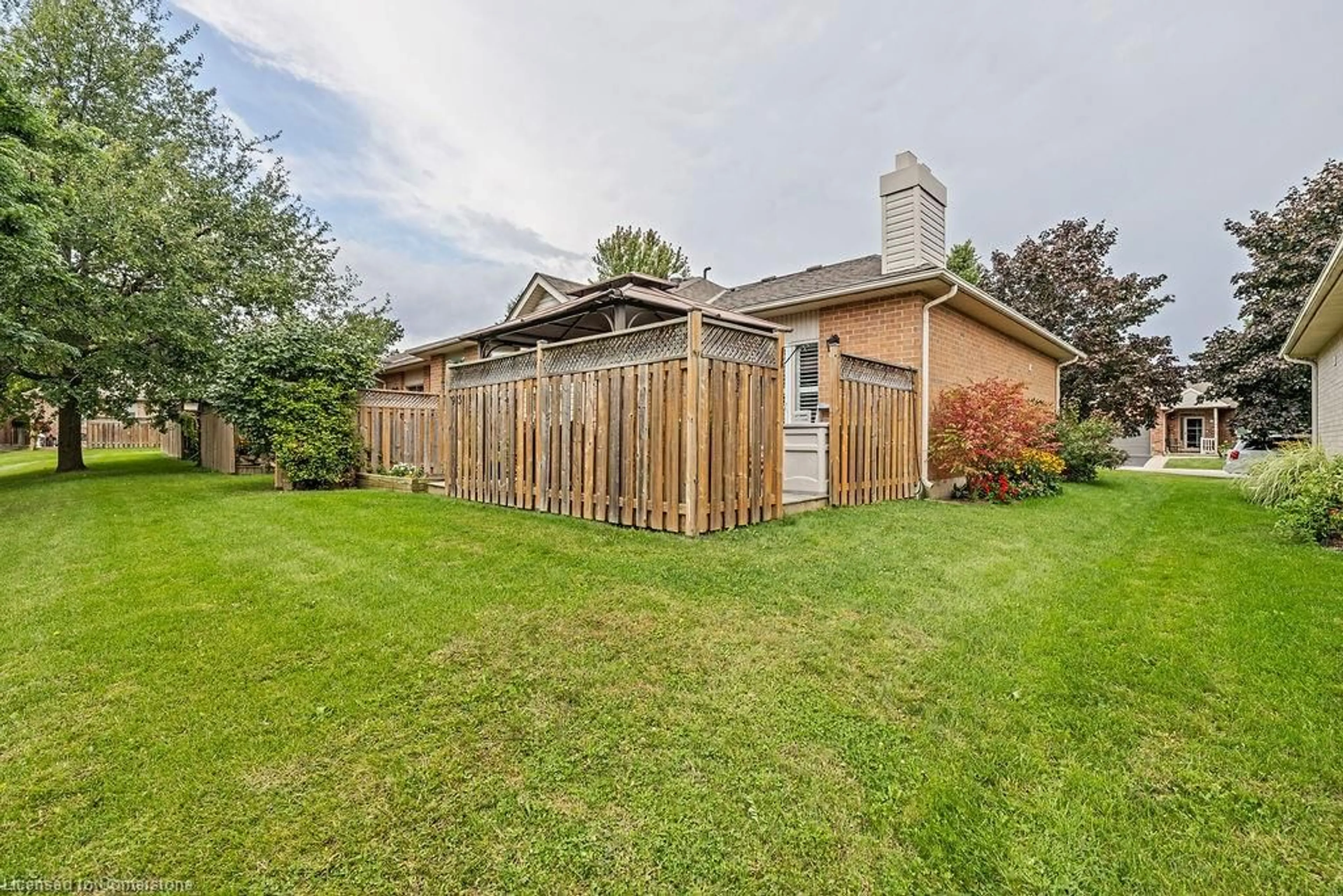 A pic from exterior of the house or condo, the fenced backyard for 95 Starfish Dr, Mount Hope Ontario L0R 1W0