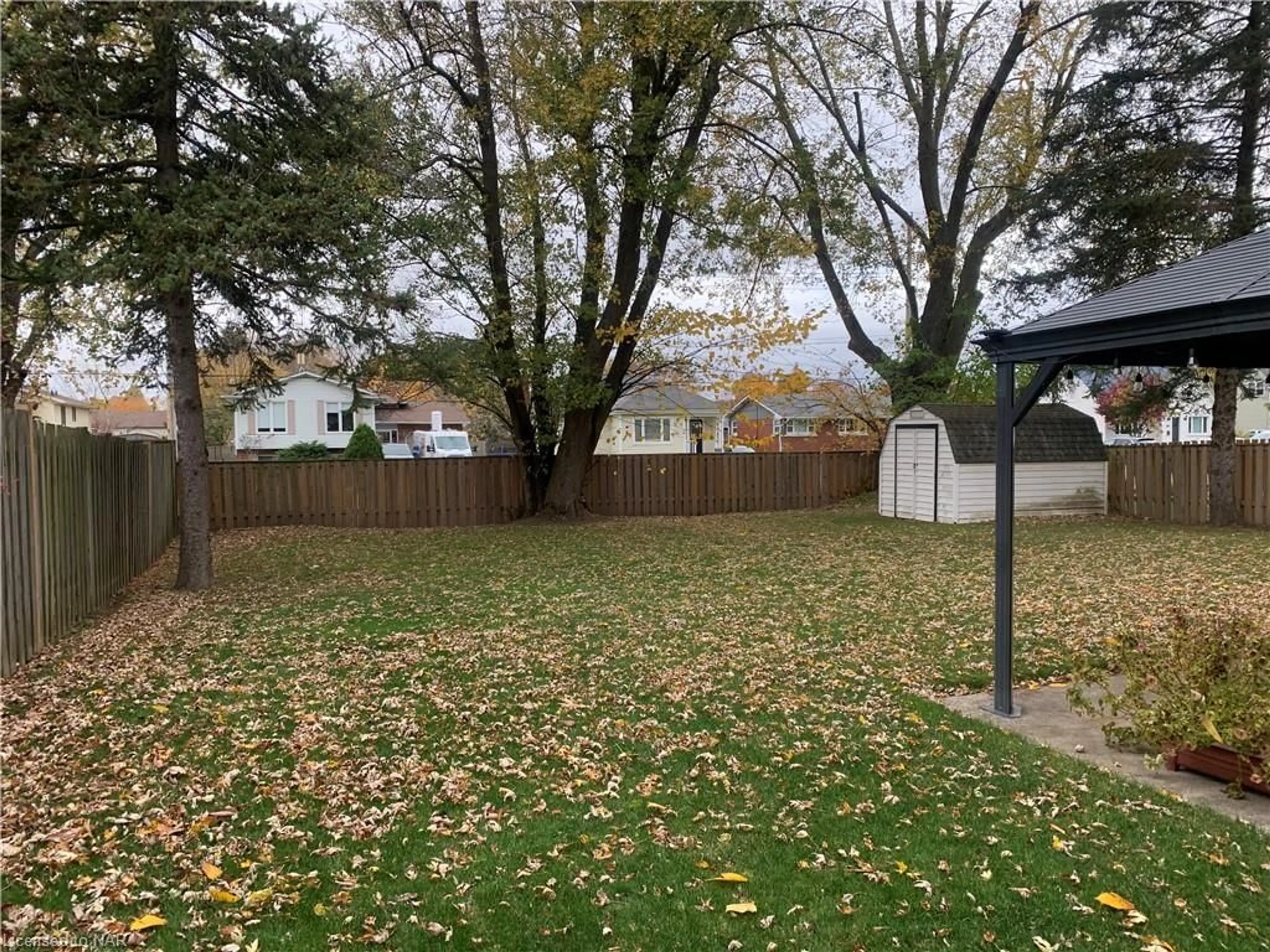 Frontside or backside of a home, the fenced backyard for 7 Cranbrook Cres, Welland Ontario L3C 3P5