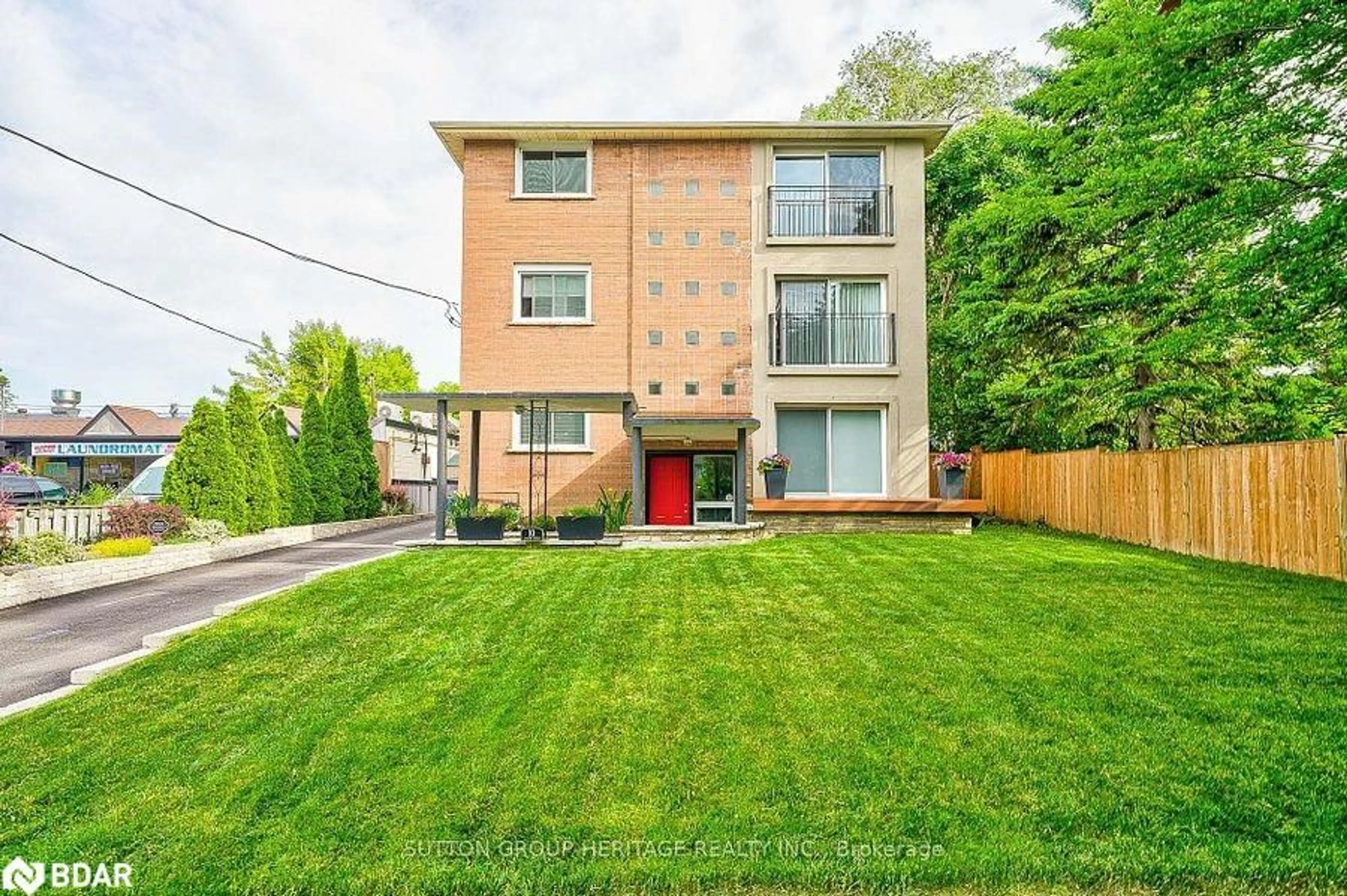 A pic from exterior of the house or condo, the fenced backyard for 10 Lincoln St, Ajax Ontario L1S 6C8