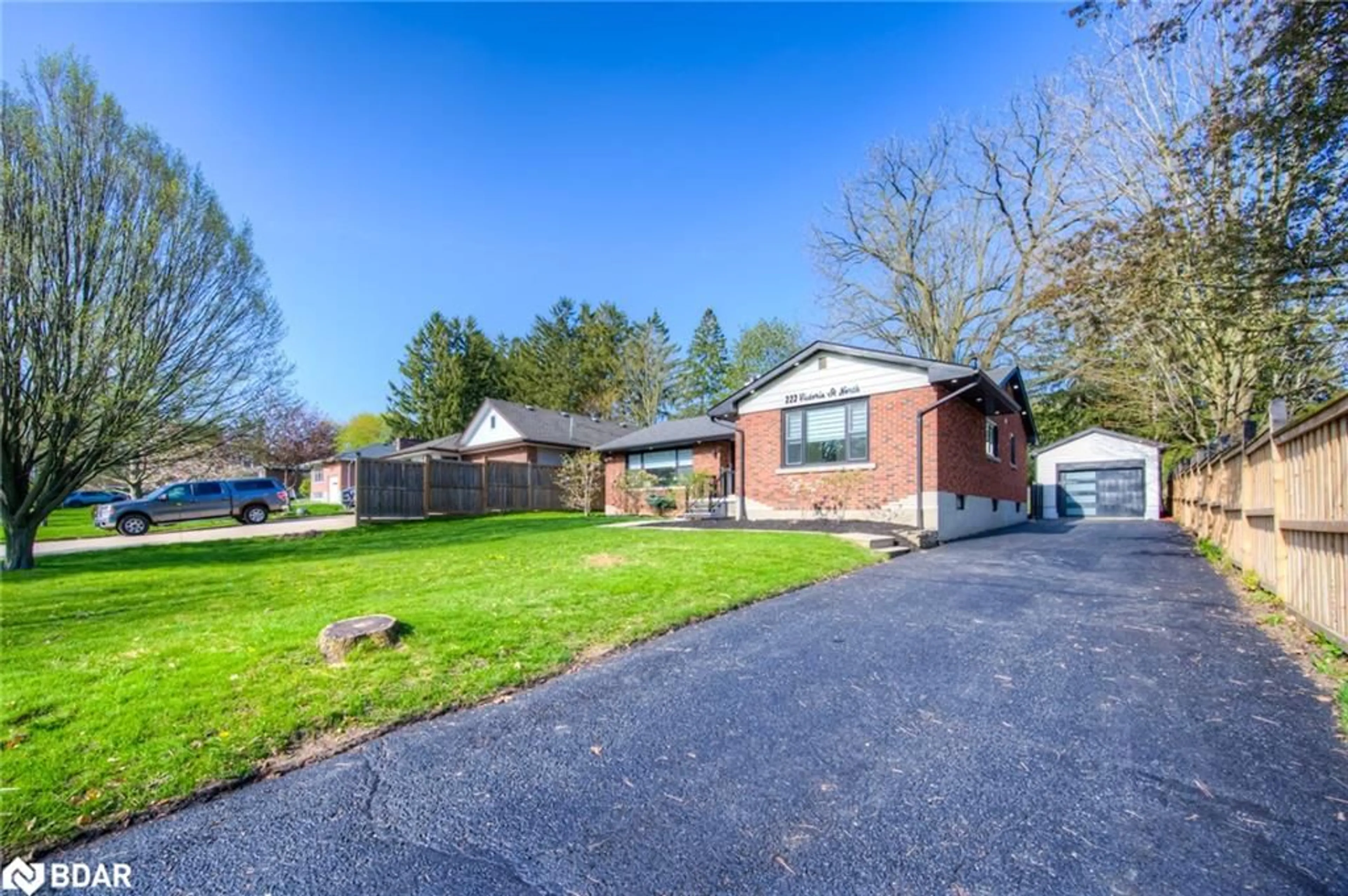 Frontside or backside of a home, the fenced backyard for 222 Victoria St, Woodstock Ontario N4S 6W3