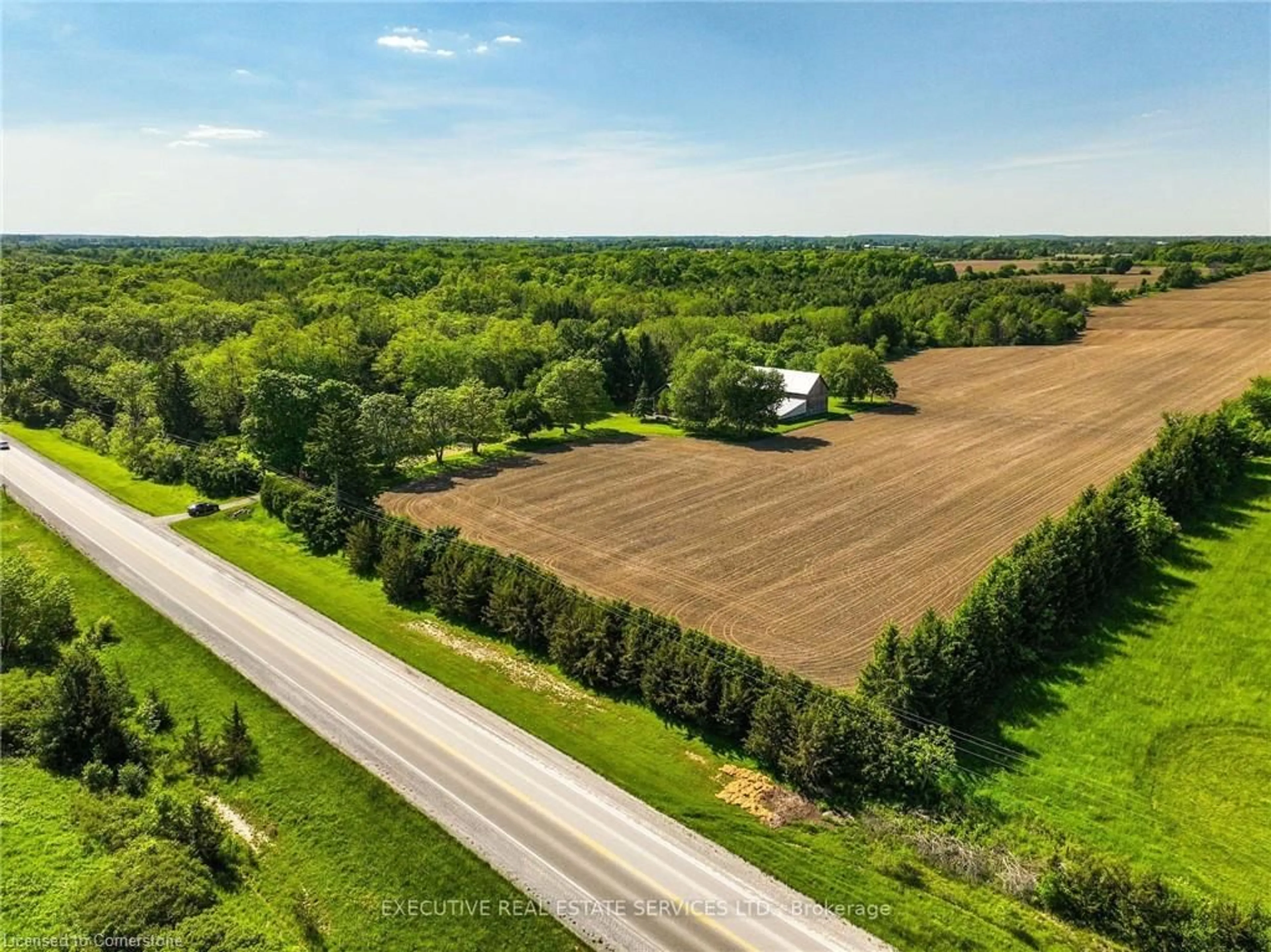 A pic from exterior of the house or condo, the street view for 1045 St. Johns Rd, Simcoe Ontario N0A 1N1