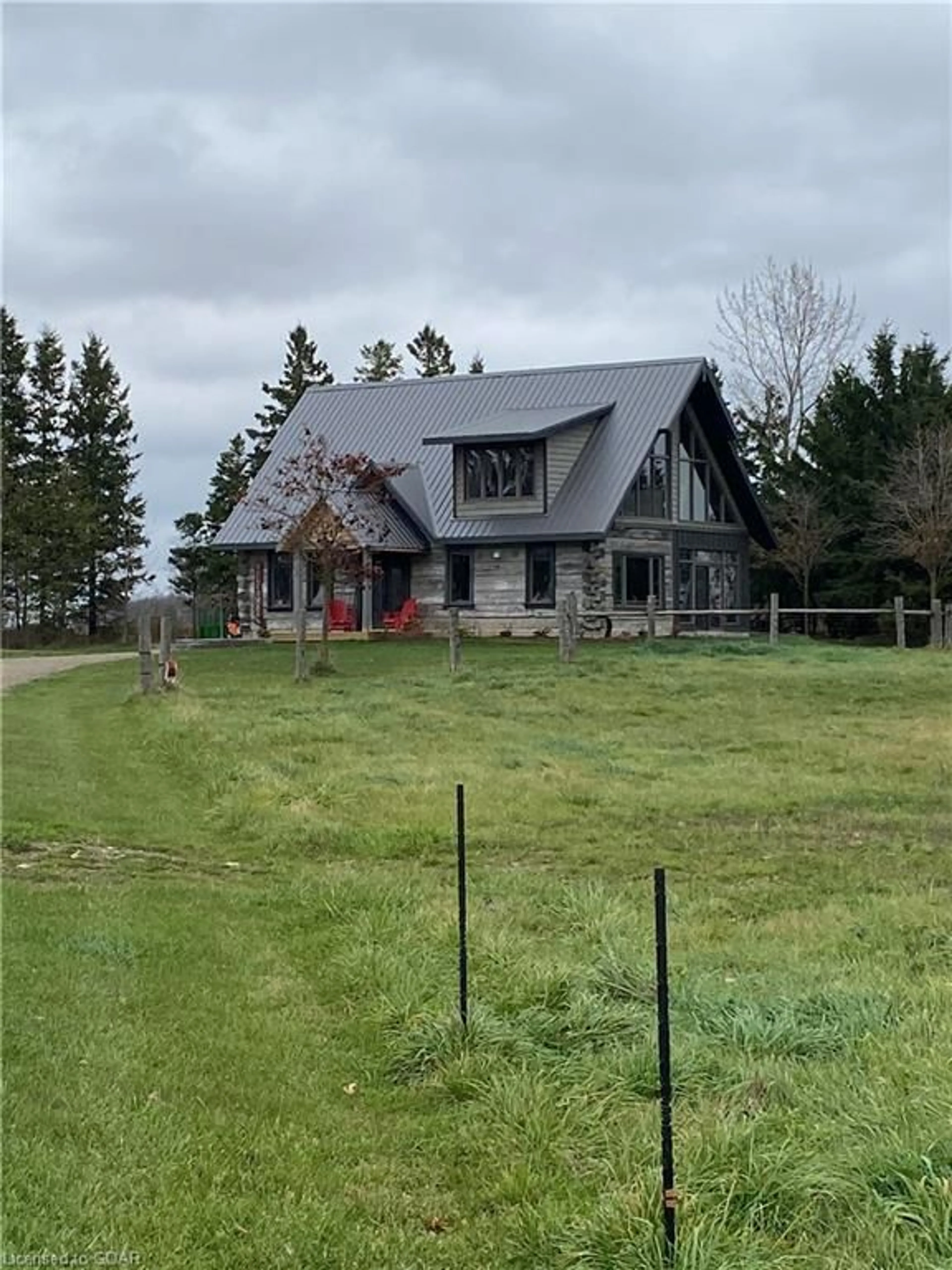 Frontside or backside of a home, the fenced backyard for 8915 Highway 6, Kenilworth Ontario N0G 2E0