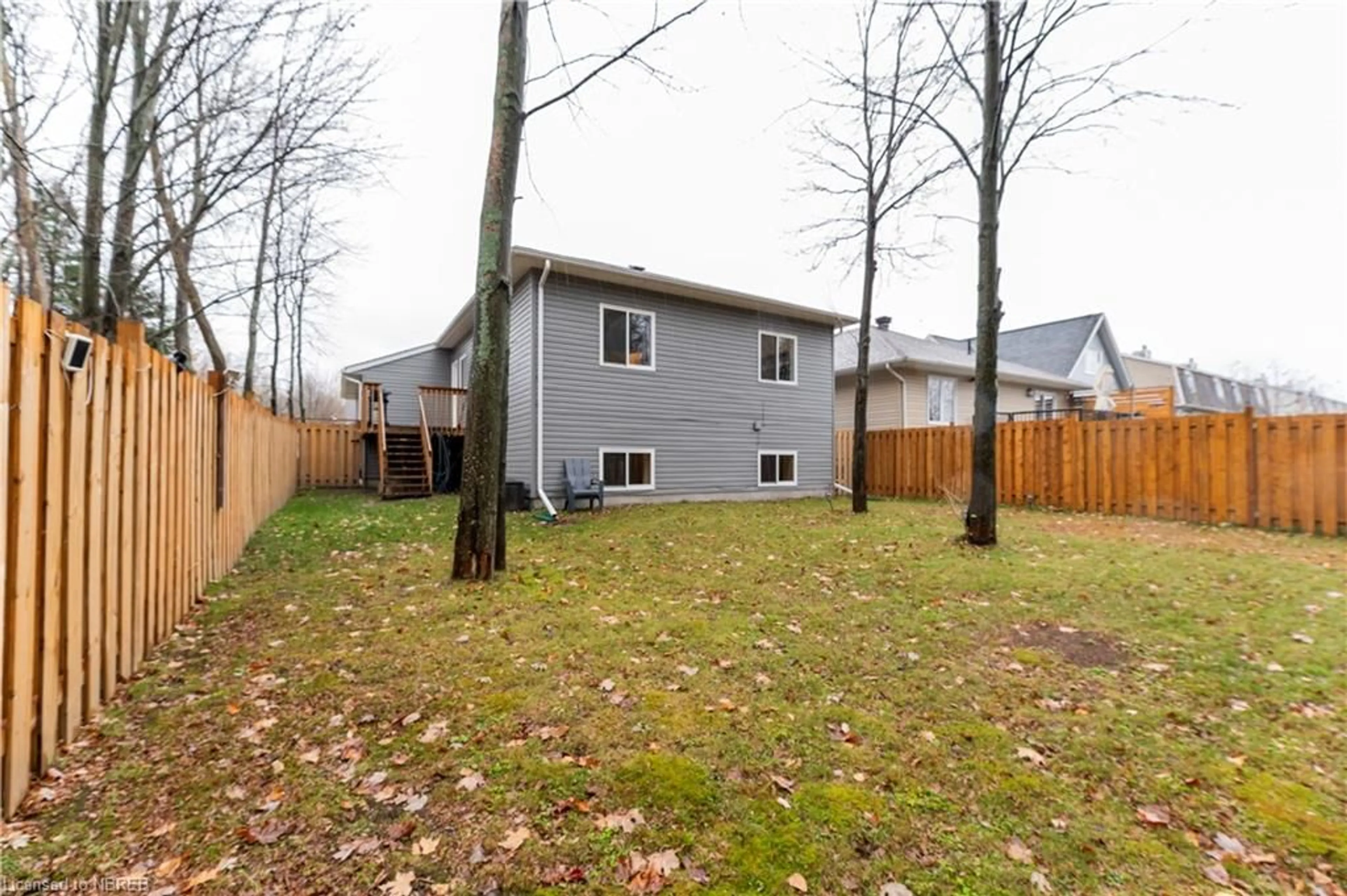 Frontside or backside of a home, the fenced backyard for 158 Thelma Ave, North Bay Ontario P1A 4M8