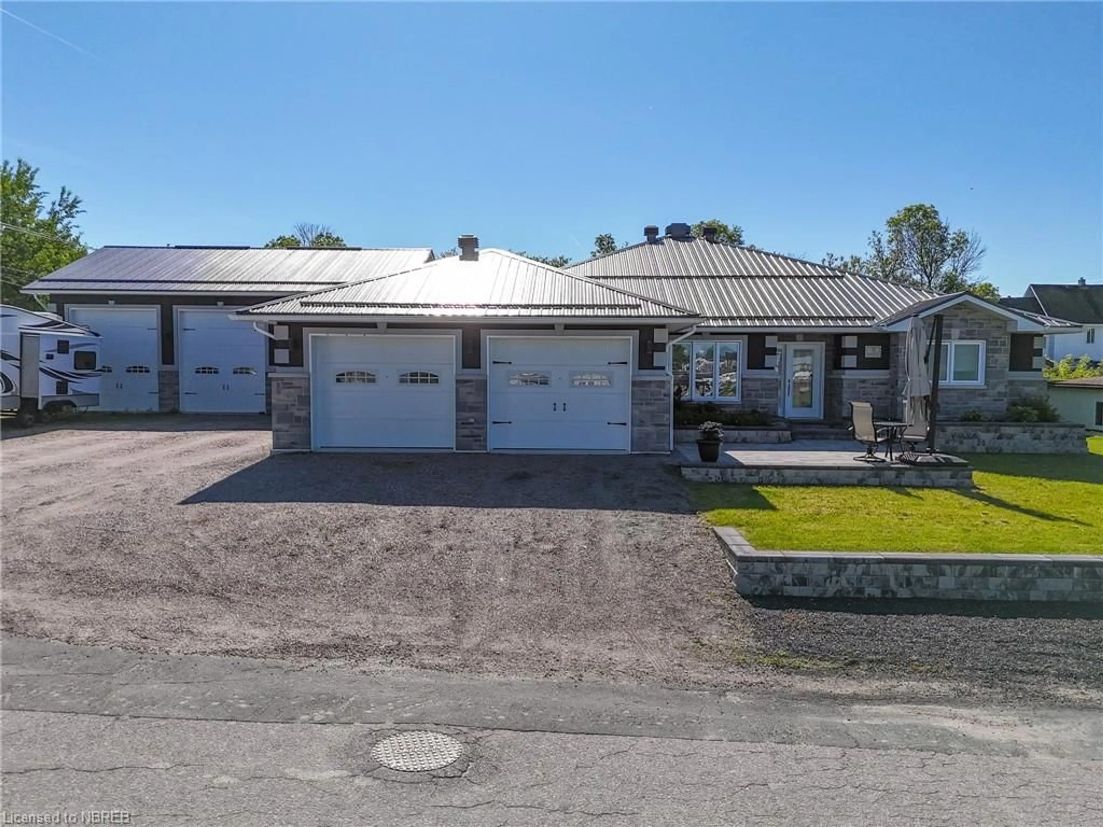 Frontside or backside of a home, the street view for 5 Young St, Cache Bay Ontario P0H 1G0