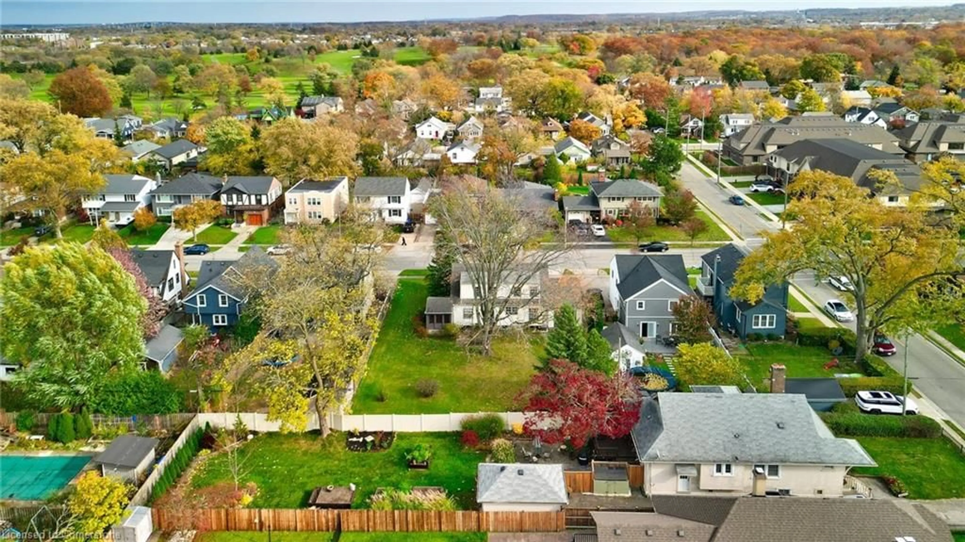 Frontside or backside of a home, the fenced backyard for 80 South Dr, St. Catharines Ontario L2R 4V4