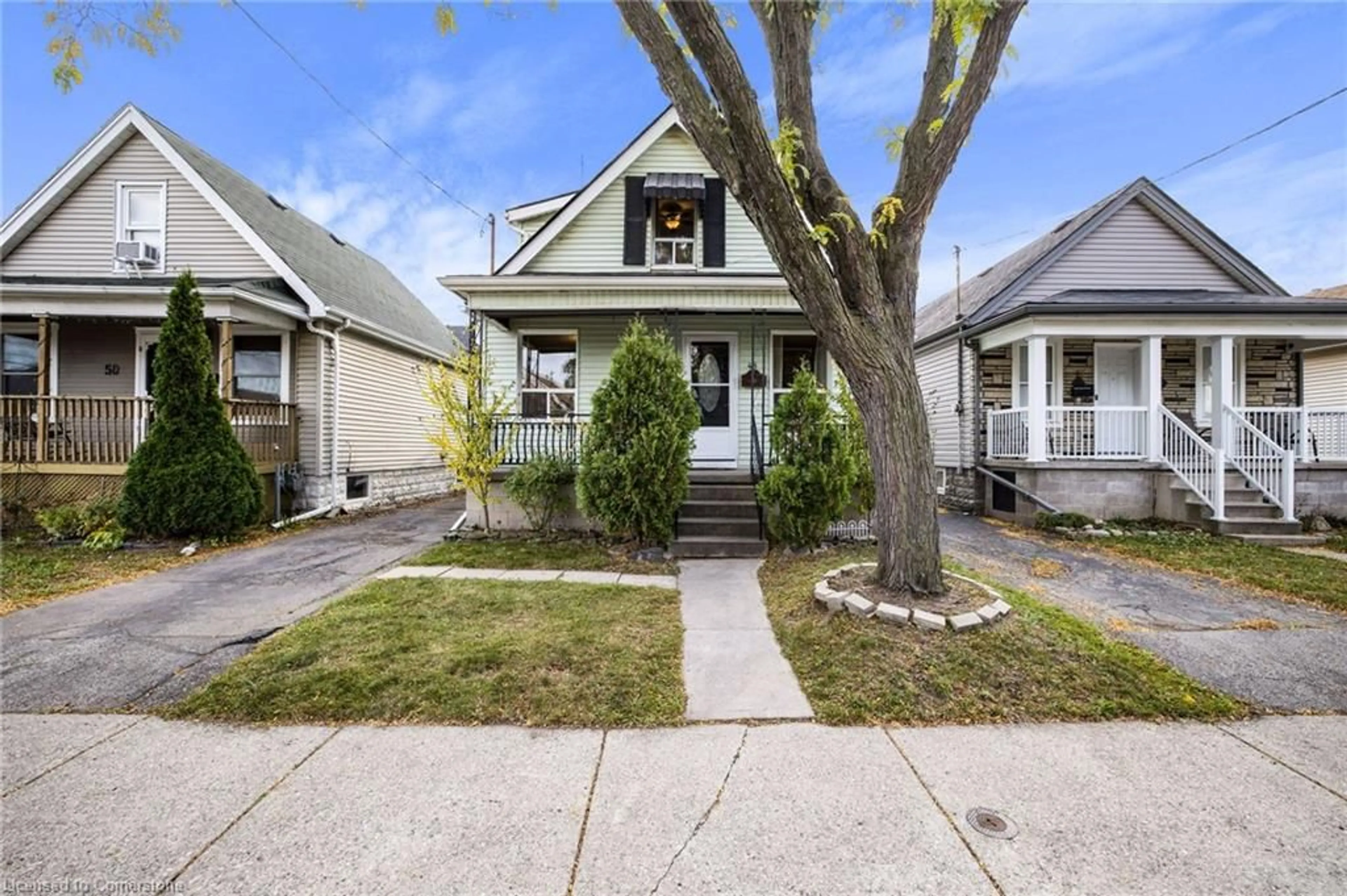 Frontside or backside of a home, the street view for 48 Tuxedo Ave, Hamilton Ontario L8H 4P5