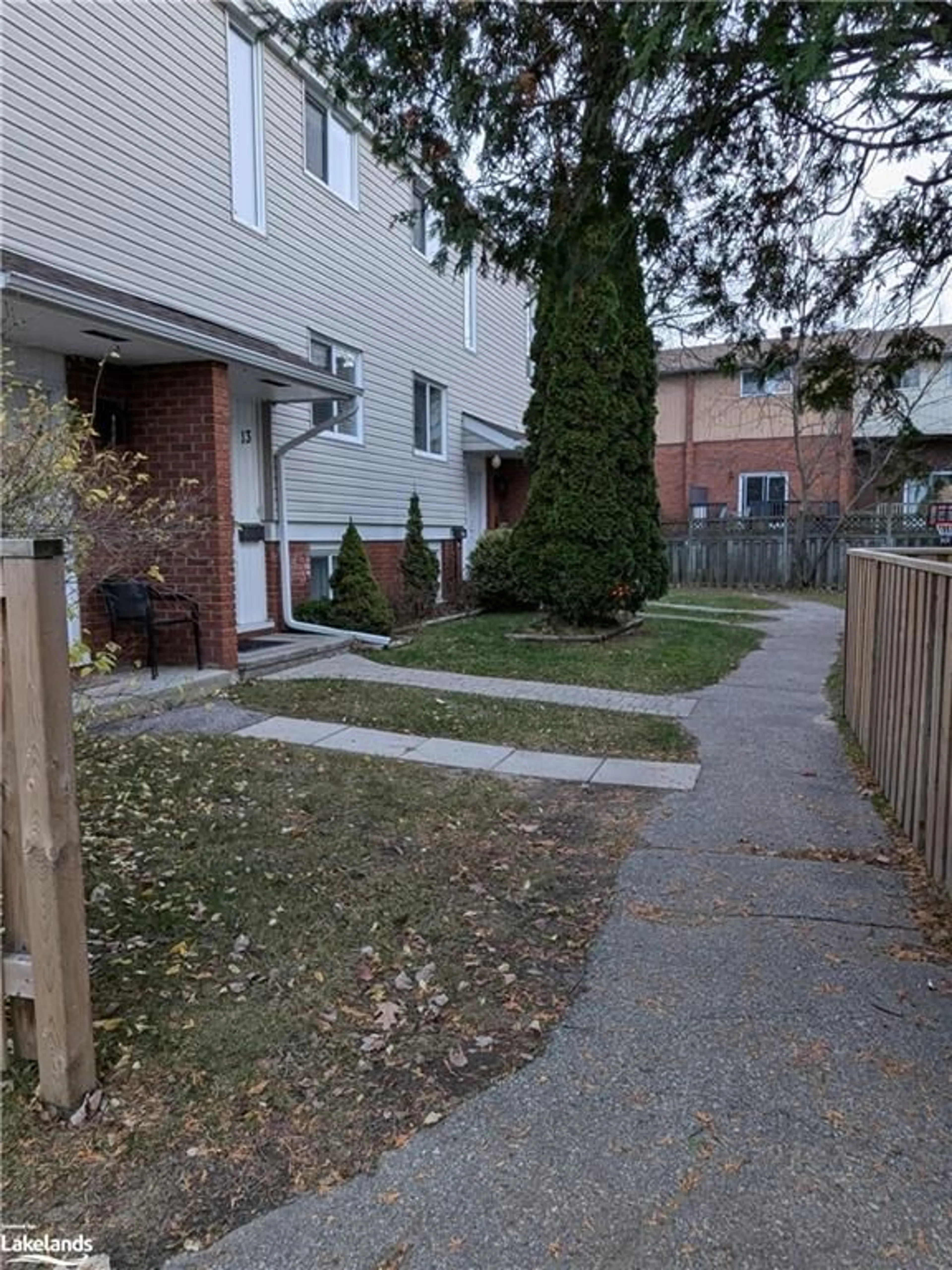 A pic from exterior of the house or condo, the fenced backyard for 604 Banner Ave #14, North Bay Ontario P1A 1X8