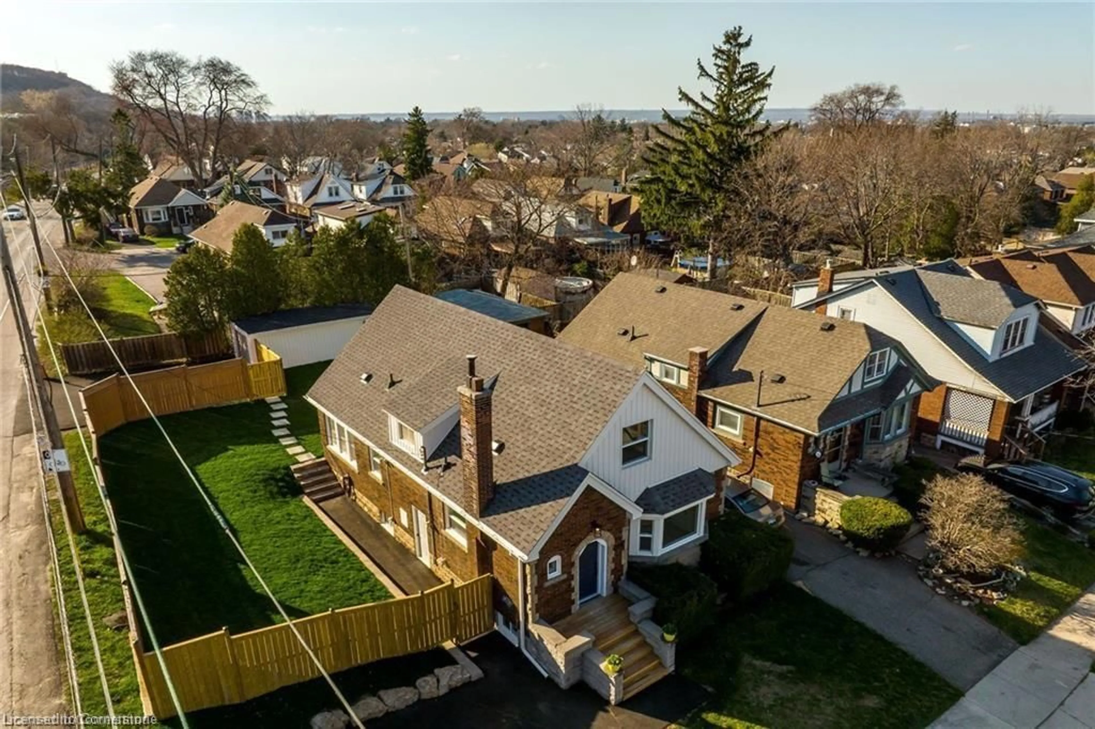 Frontside or backside of a home, the fenced backyard for 316 Houghton Ave, Hamilton Ontario L9K 2N3