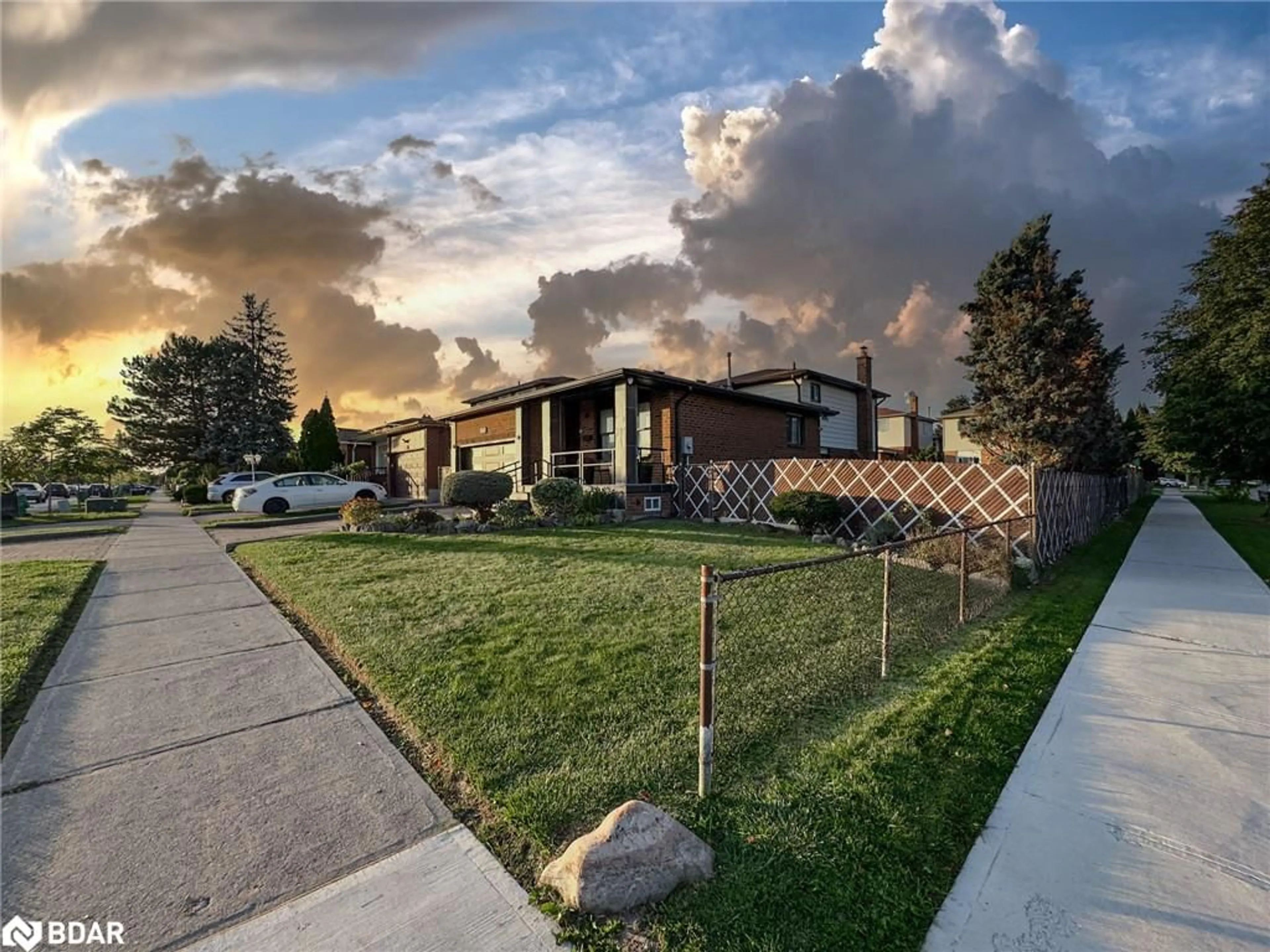 Frontside or backside of a home, the fenced backyard for 184 Vodden St, Brampton Ontario L6X 2V3