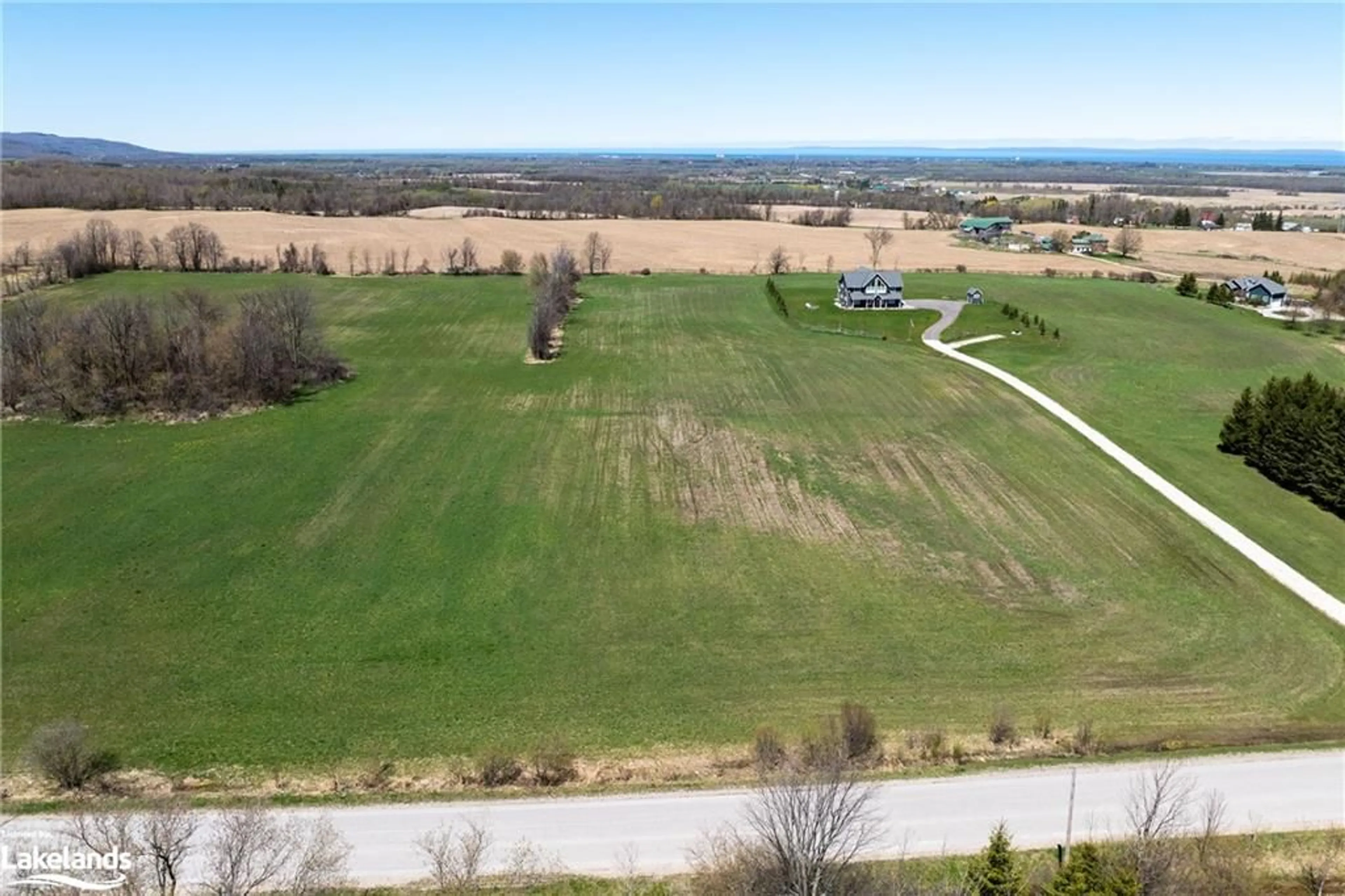 A pic from exterior of the house or condo, the fenced backyard for 22 Sydenham Trail, Duntroon Ontario L0M 1H0