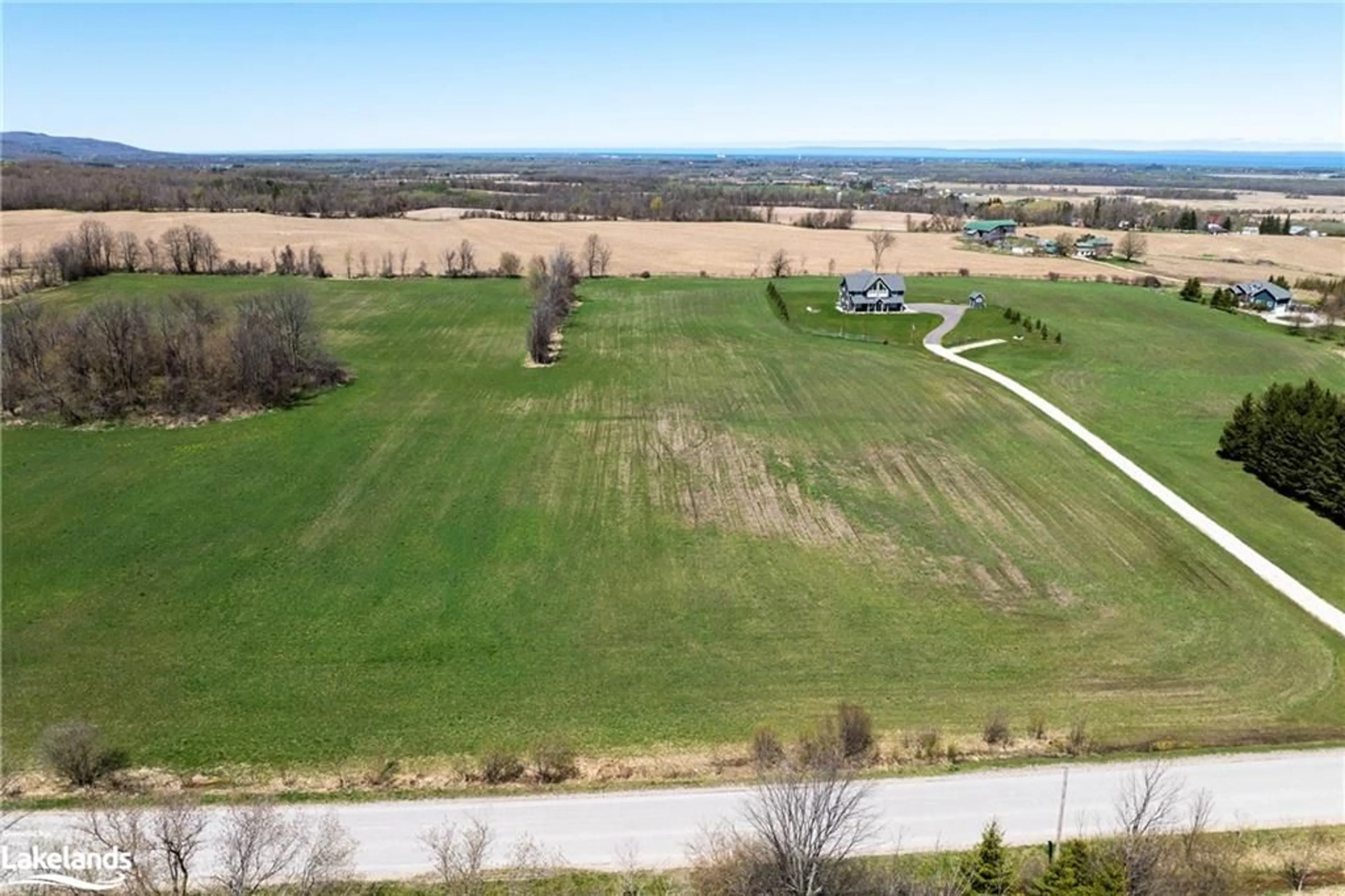 A pic from exterior of the house or condo, the fenced backyard for 22 Sydenham Trail, Duntroon Ontario L0M 1H0