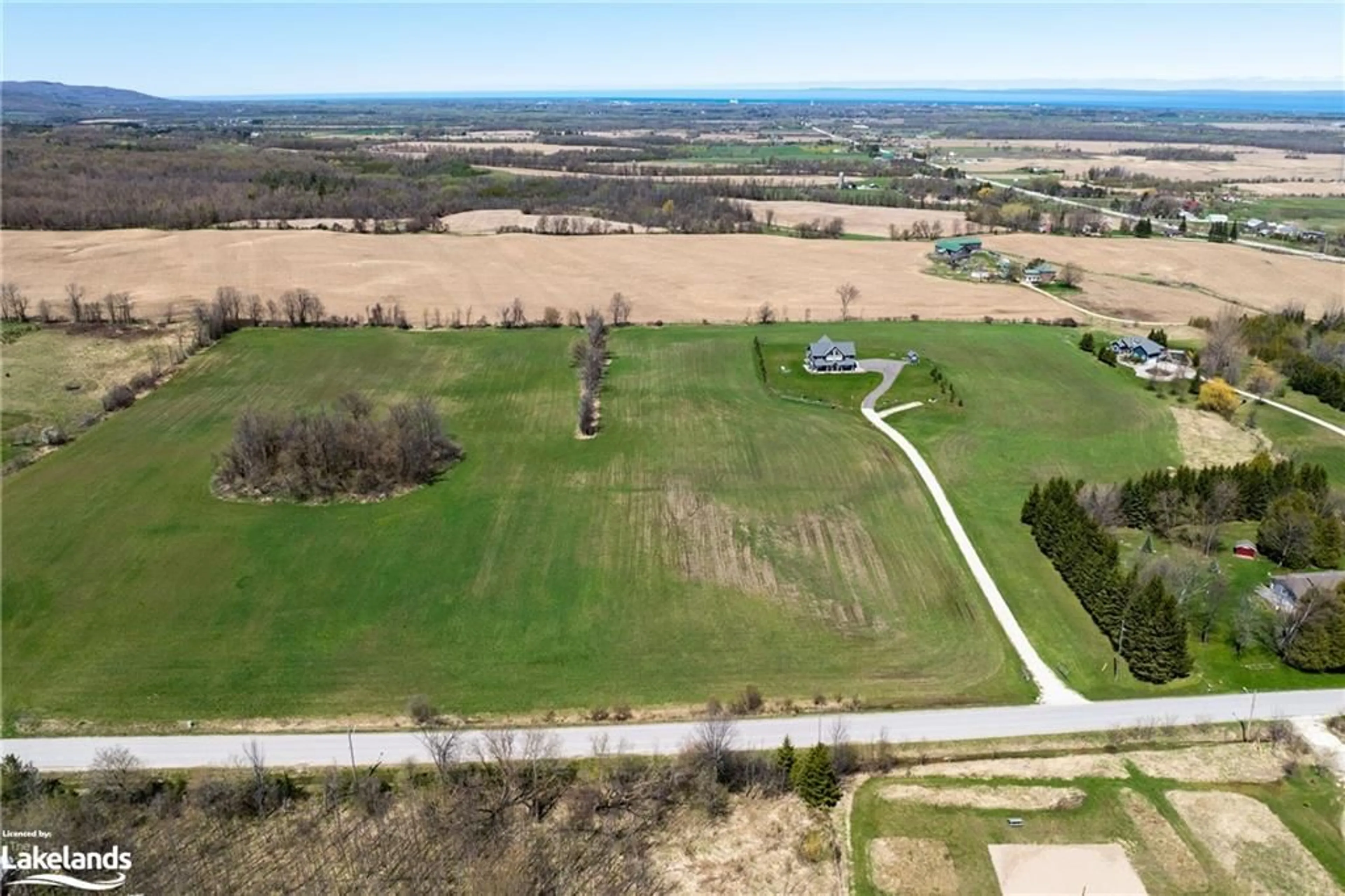 A pic from exterior of the house or condo, the fenced backyard for 22 Sydenham Trail, Duntroon Ontario L0M 1H0