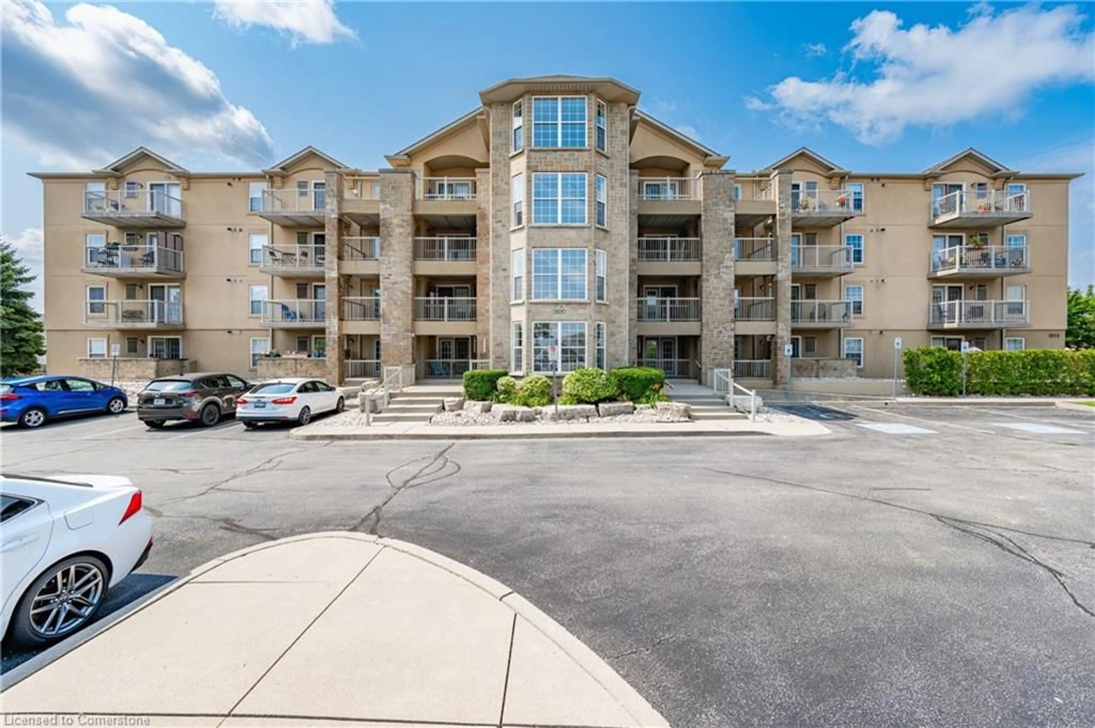 A pic from exterior of the house or condo, the front or back of building for 1800 Walkers Line #310, Burlington Ontario L7M 4V2