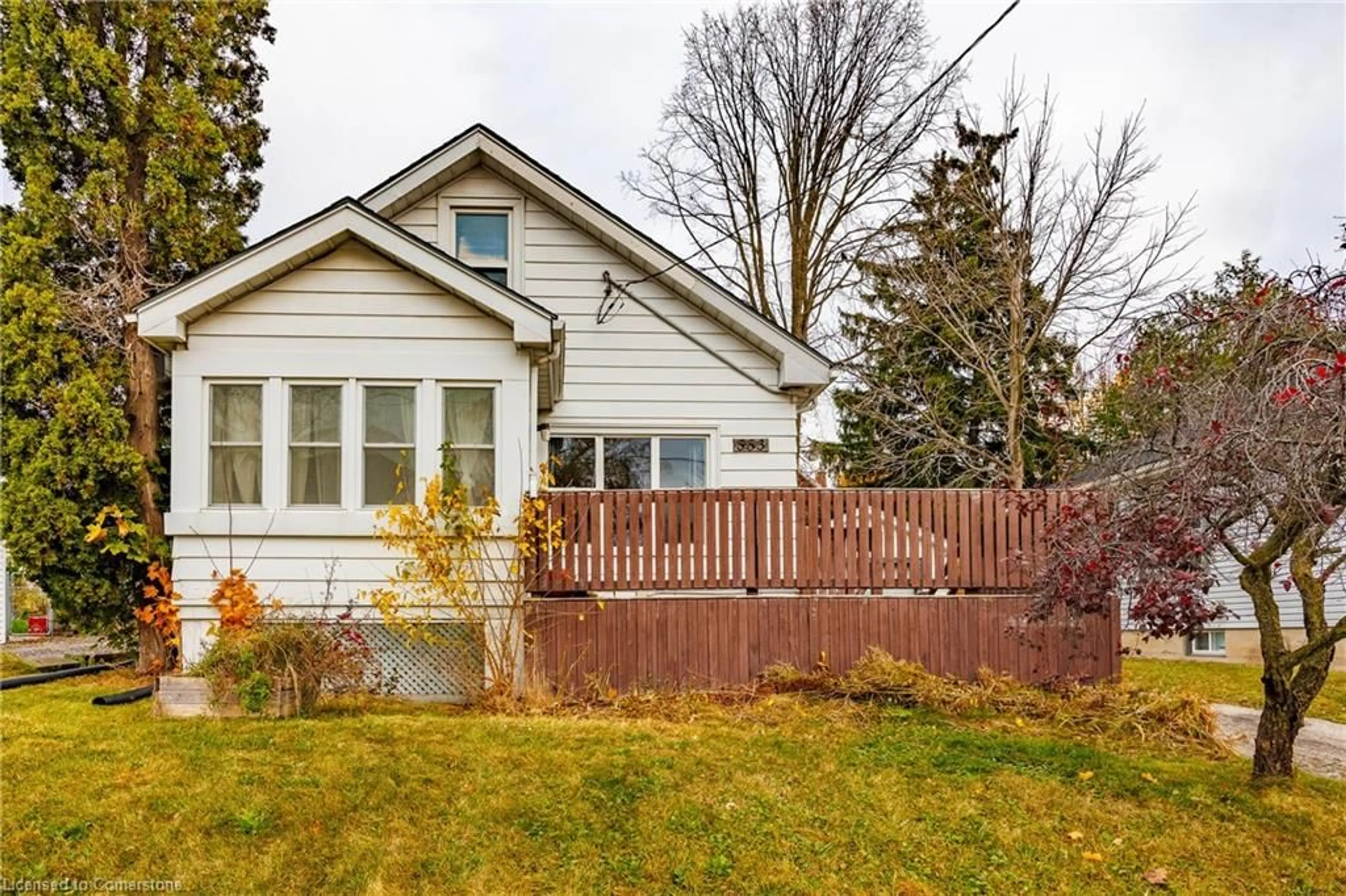 Frontside or backside of a home, the fenced backyard for 553 Main St, Woodstock Ontario N4S 1V3