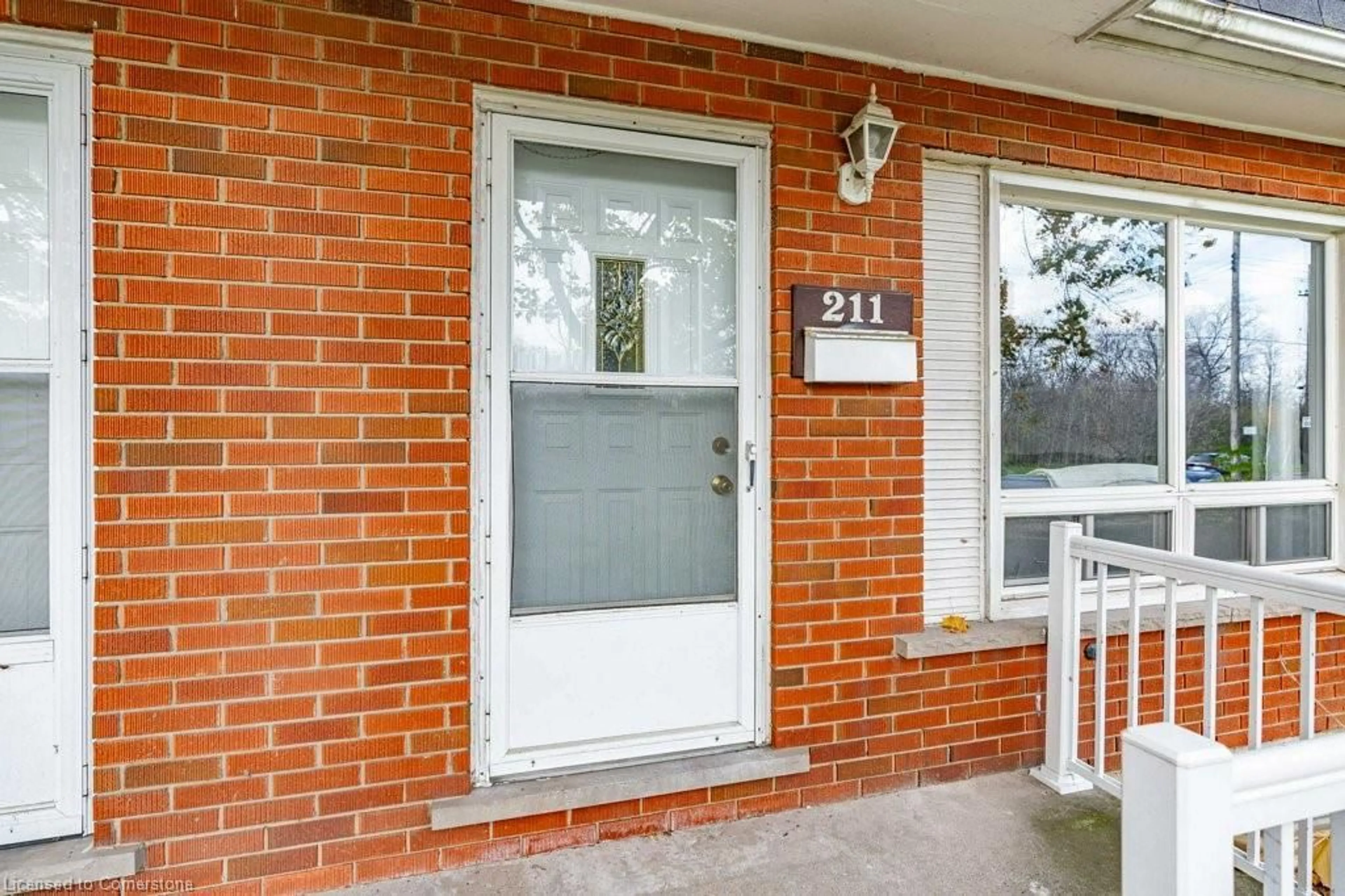 Home with brick exterior material for 211 Lake Ave, Hamilton Ontario L8E 1H6