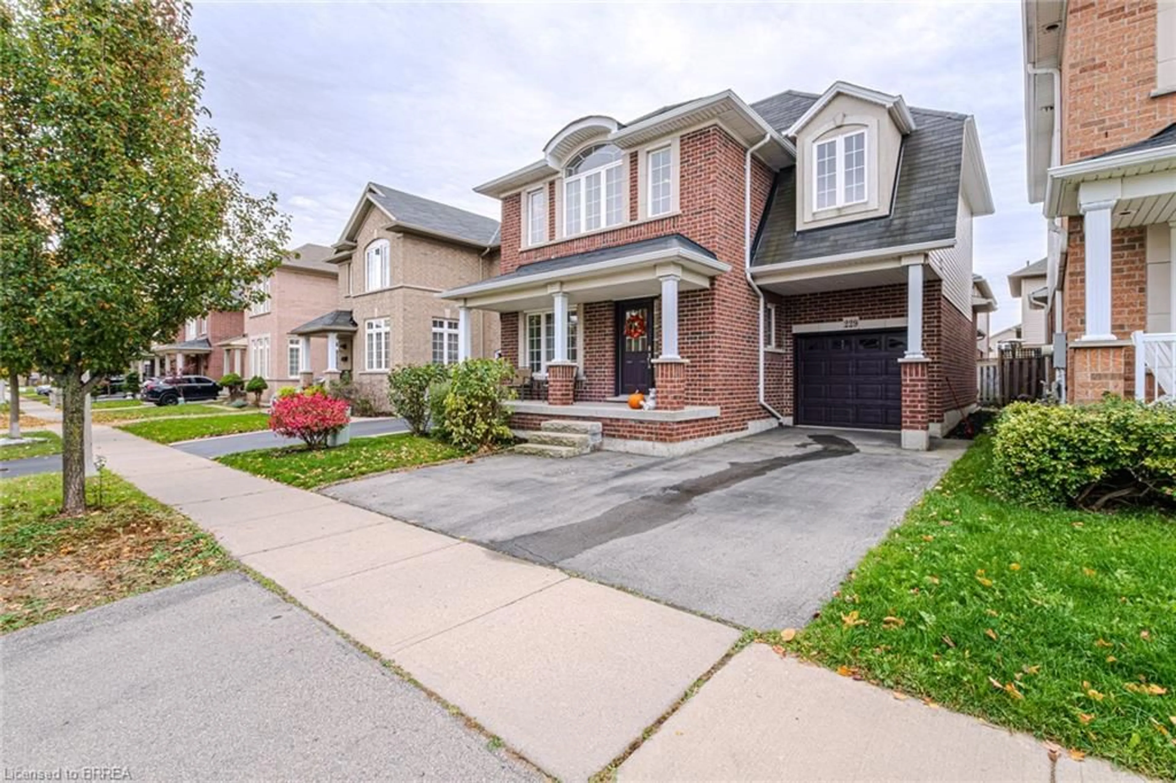 Home with brick exterior material for 229 Springvalley Cres, Hamilton Ontario L9C 0B3