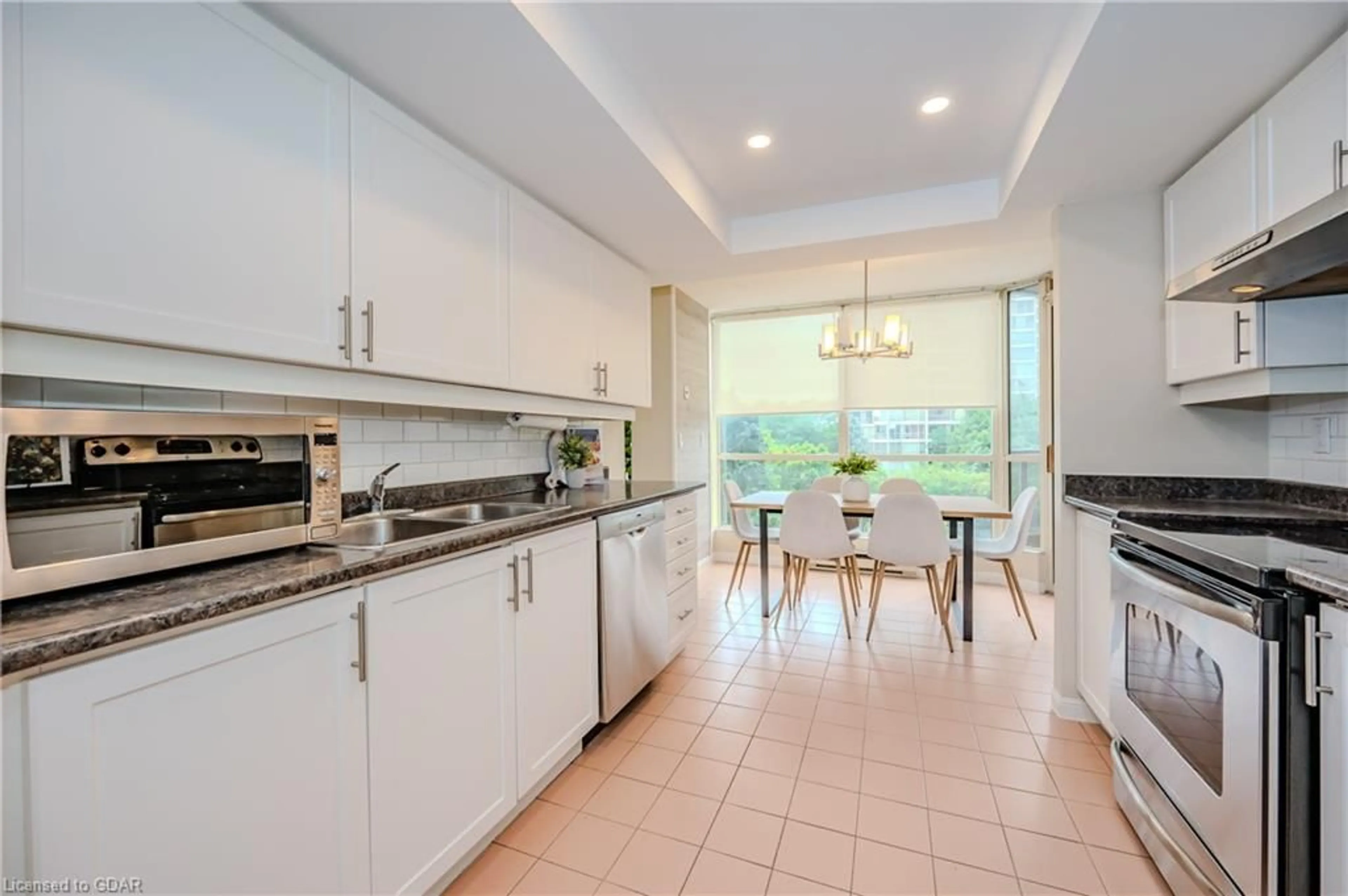 Kitchen, ceramic floors, cottage for 55 Kingsbridge Garden Cir #406, Mississauga Ontario L5R 1Y1