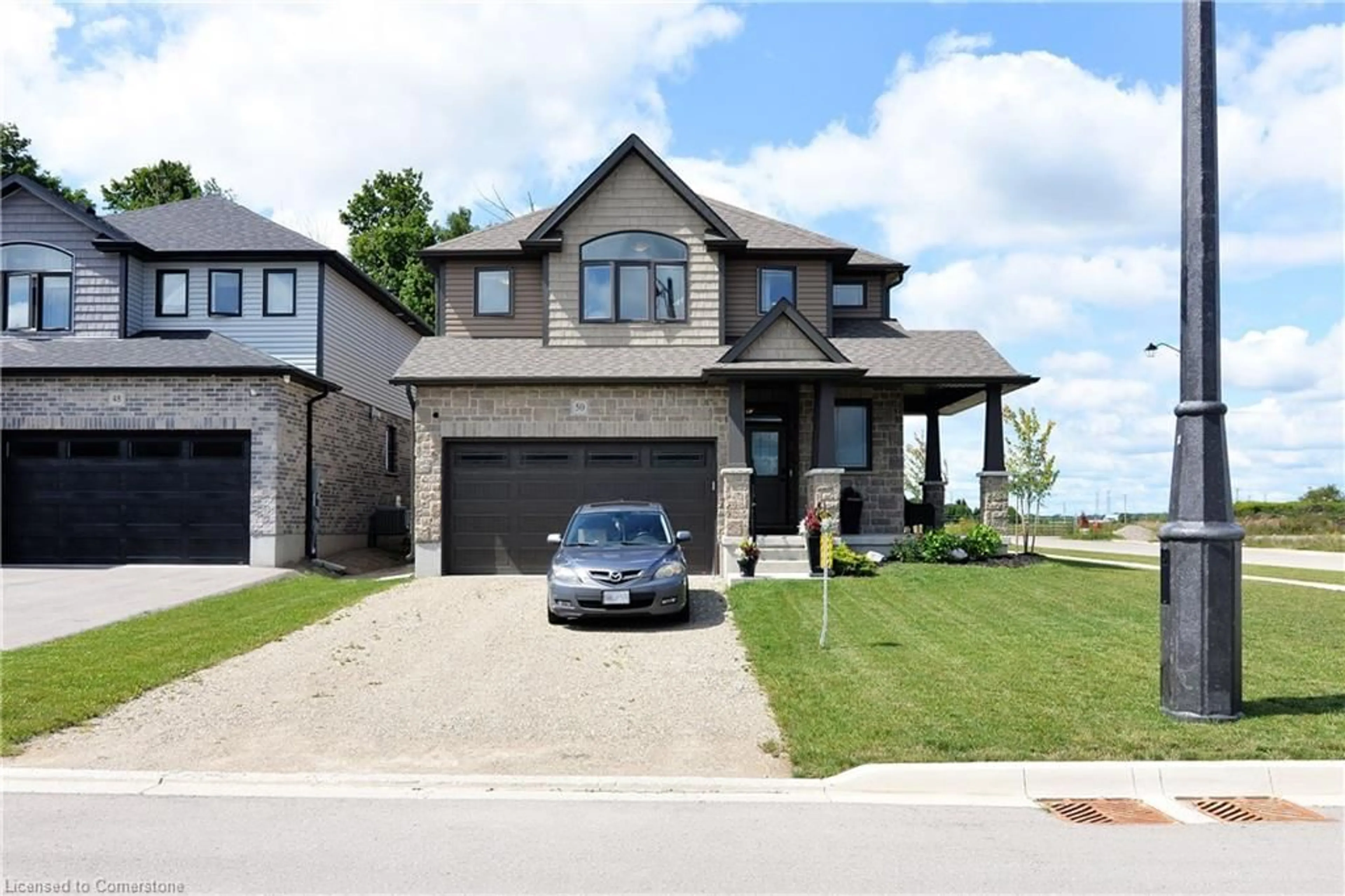 Frontside or backside of a home, the street view for 50 Tindall Cres Cres, East Luther-Grand Valley Ontario L9W 7R8