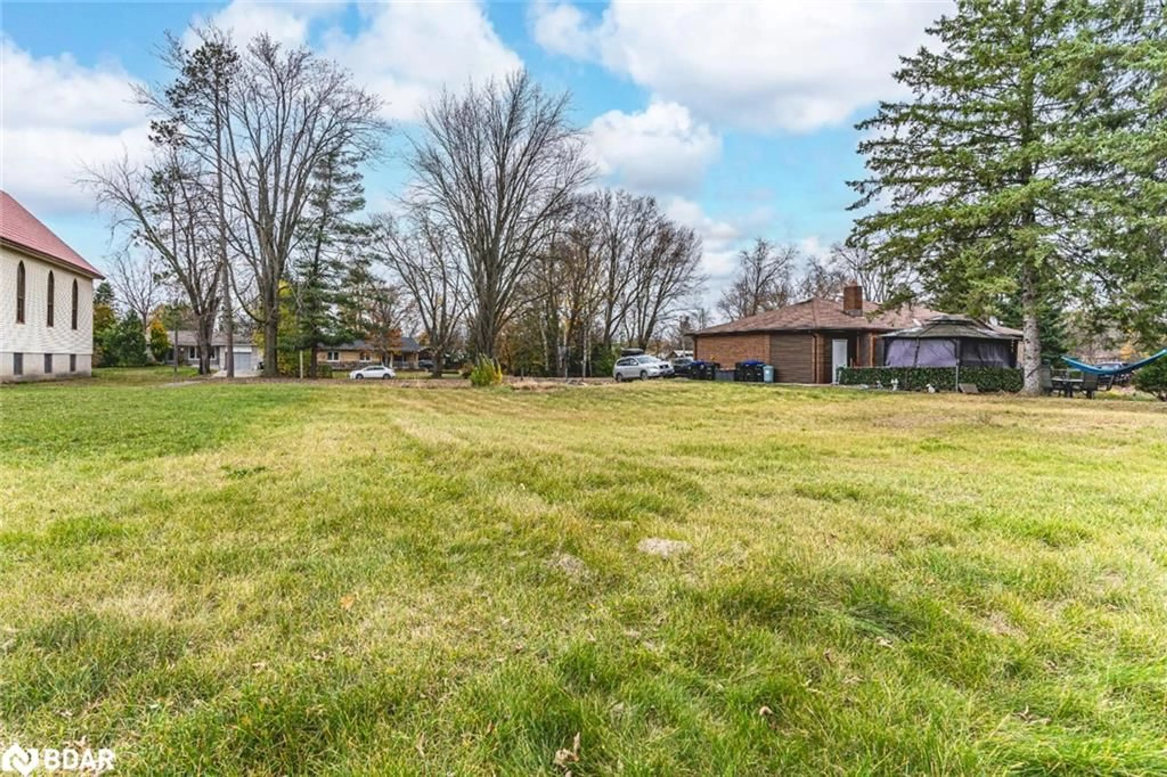 Frontside or backside of a home, the fenced backyard for 58 Jonas St, Angus Ontario L0M 1B0