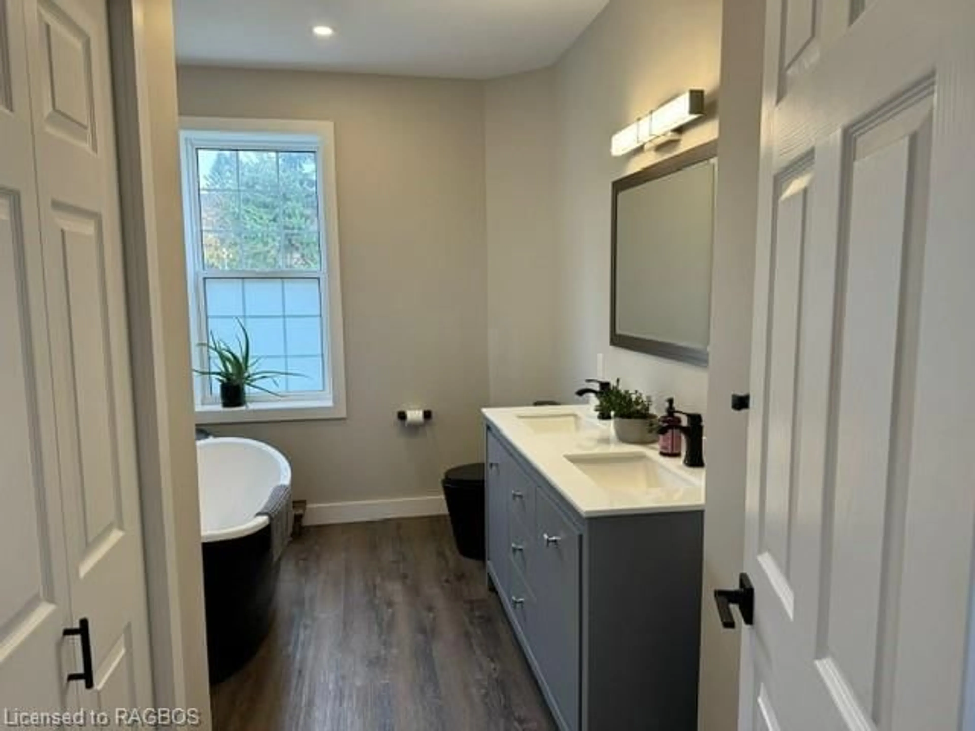 Contemporary bathroom, wood floors for 53 Concession 6th, Chepstow Ontario N0G 1K0