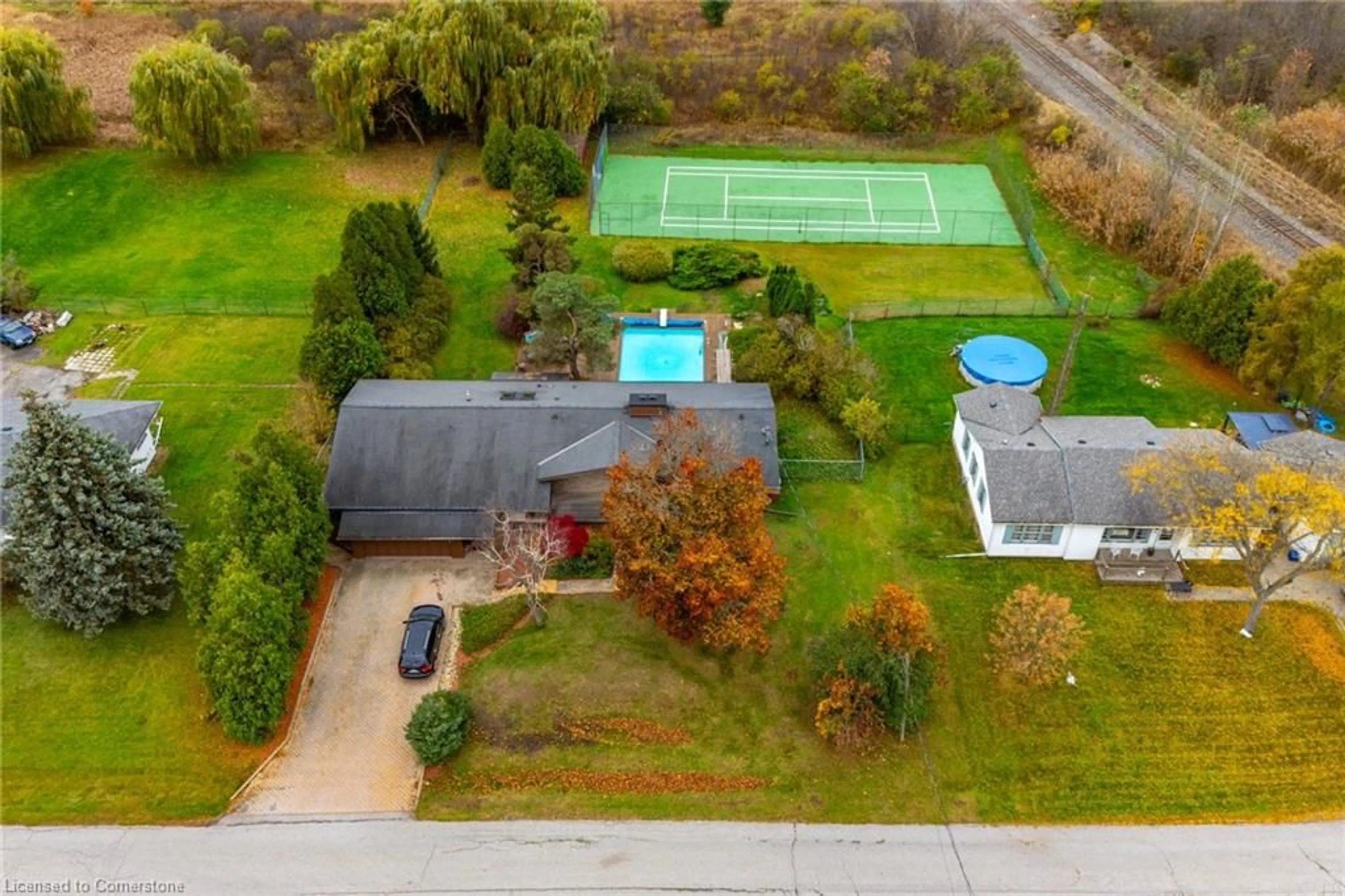 Frontside or backside of a home, the fenced backyard for 60 Atkinson Blvd, Dundas Ontario L9H 7A7