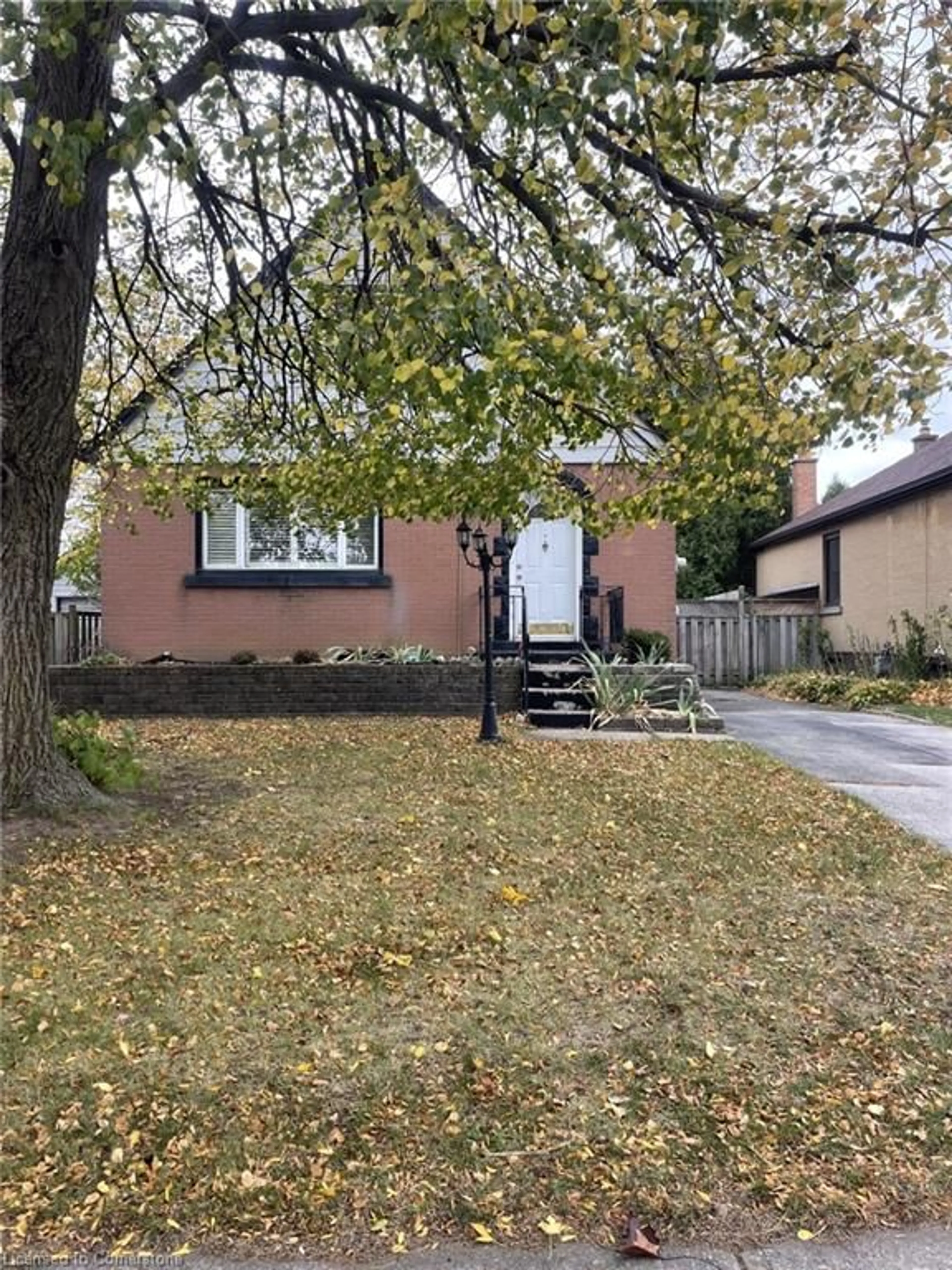 Frontside or backside of a home, the fenced backyard for 83 East 41st St, Hamilton Ontario L8T 2Z5